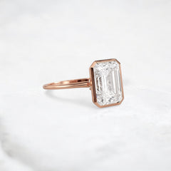 secret-glimmer-emerald-cut-bezel-moissanite-engagement-ring-4-ct-rose-gold-gemfora-2