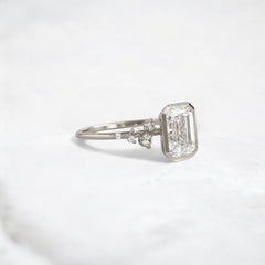 silent-luster-emerald-cluster-bezel-moissanite-engagement-ring-1-ct-white-gold-gemfora-2