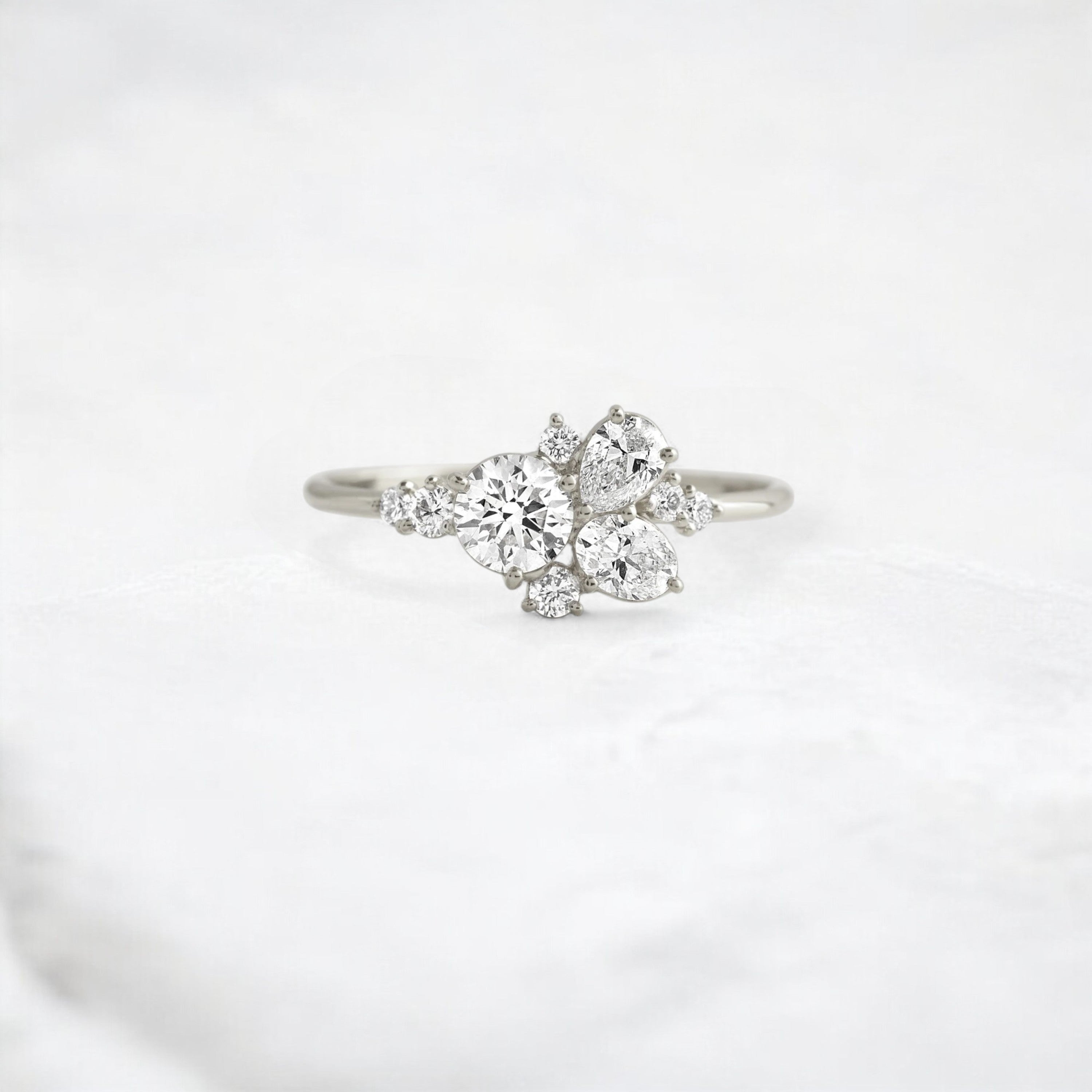 starpetal-whispers-round-cluster-love-engagement-ring-0-30-ct-platinum-gemfora-1