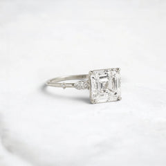 Three Stone 3.0CT Asscher Cut Moissanite Accented Two Marquise And Eight Round Four Prong