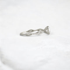 twist-of-love-round-cut-moissanite-pave-engagement-ring-0-70-ct-platinum-gemfora-3