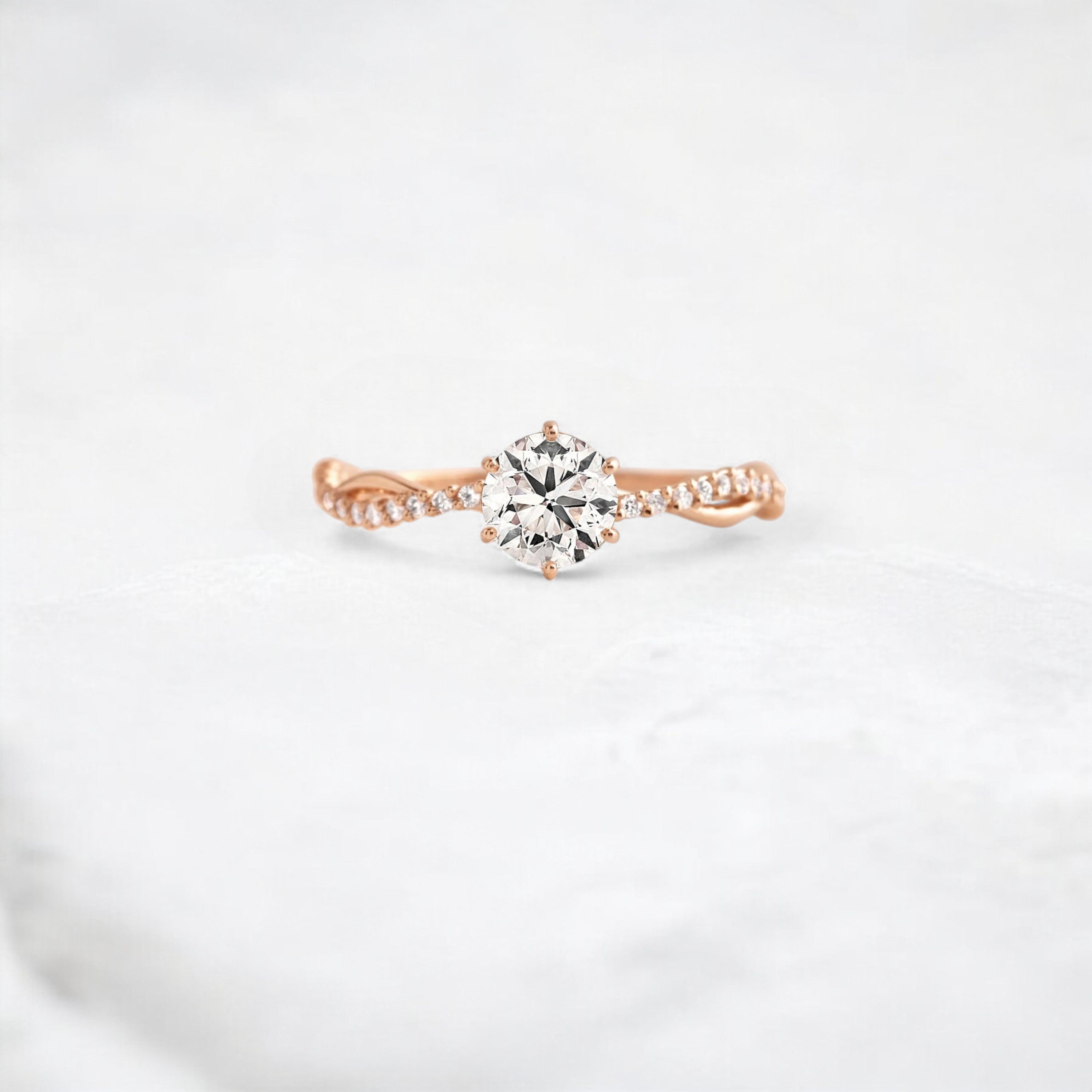 twist-of-love-round-cut-moissanite-pave-engagement-ring-0-70-ct-rose-gold-gemfora-1