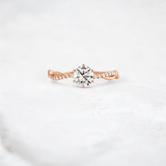 twist-of-love-round-cut-moissanite-pave-engagement-ring-0-70-ct-rose-gold-gemfora-1