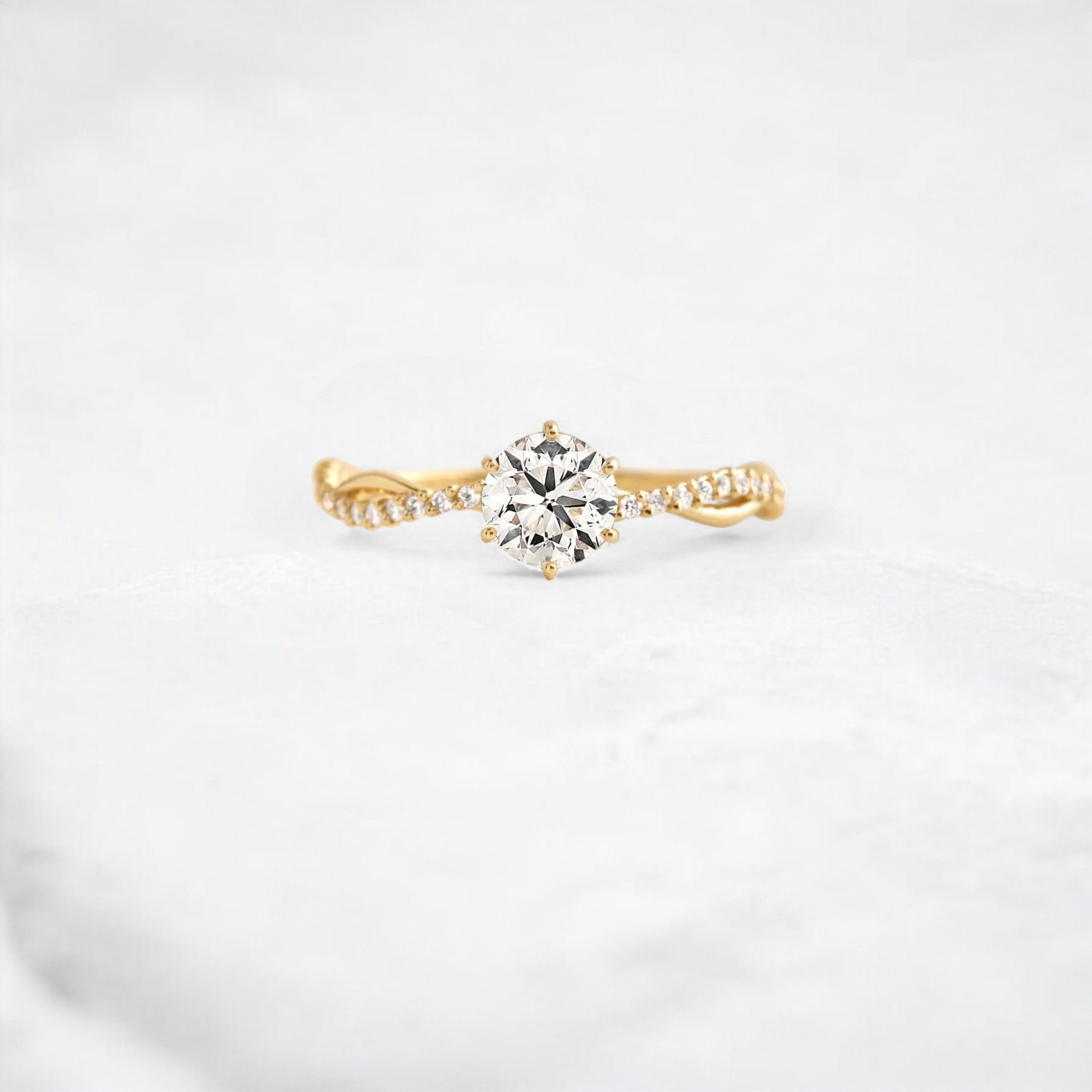 twist-of-love-round-cut-moissanite-pave-engagement-ring-0-70-ct-yellow-gold-gemfora-1
