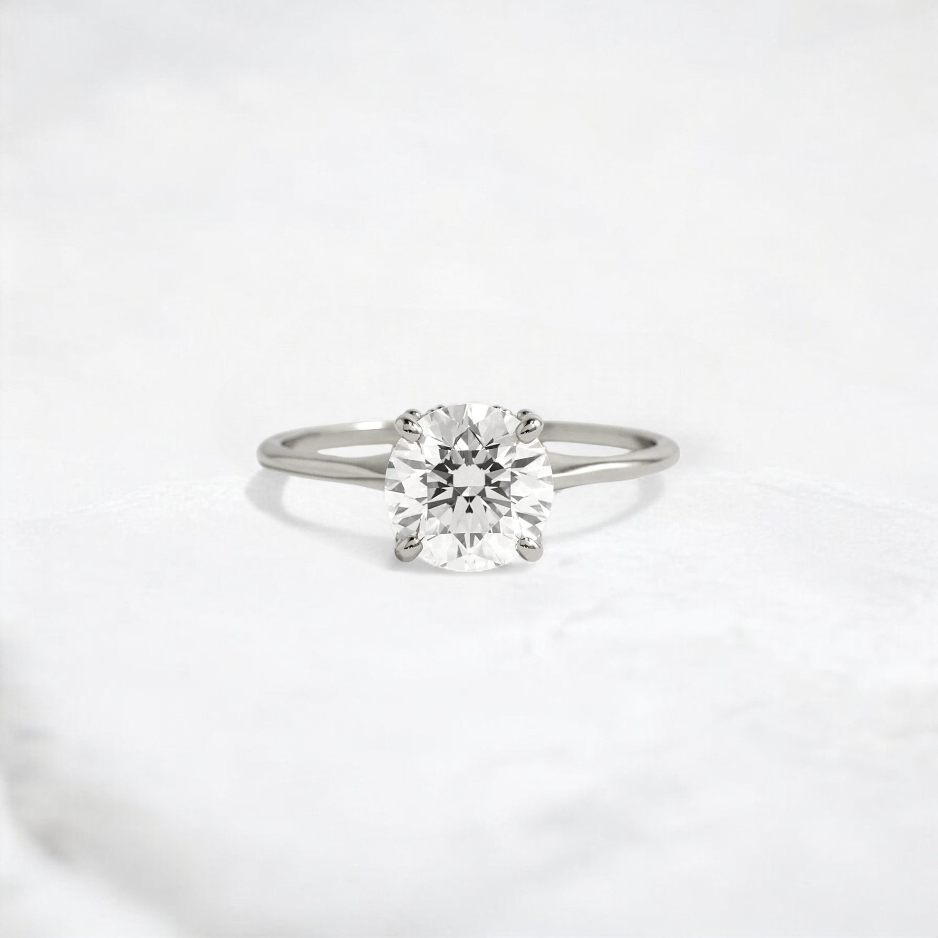 whispering-aurora-round-v-embrace-solitaire-engagement-ring-2-ct-platinum-gemfora-1