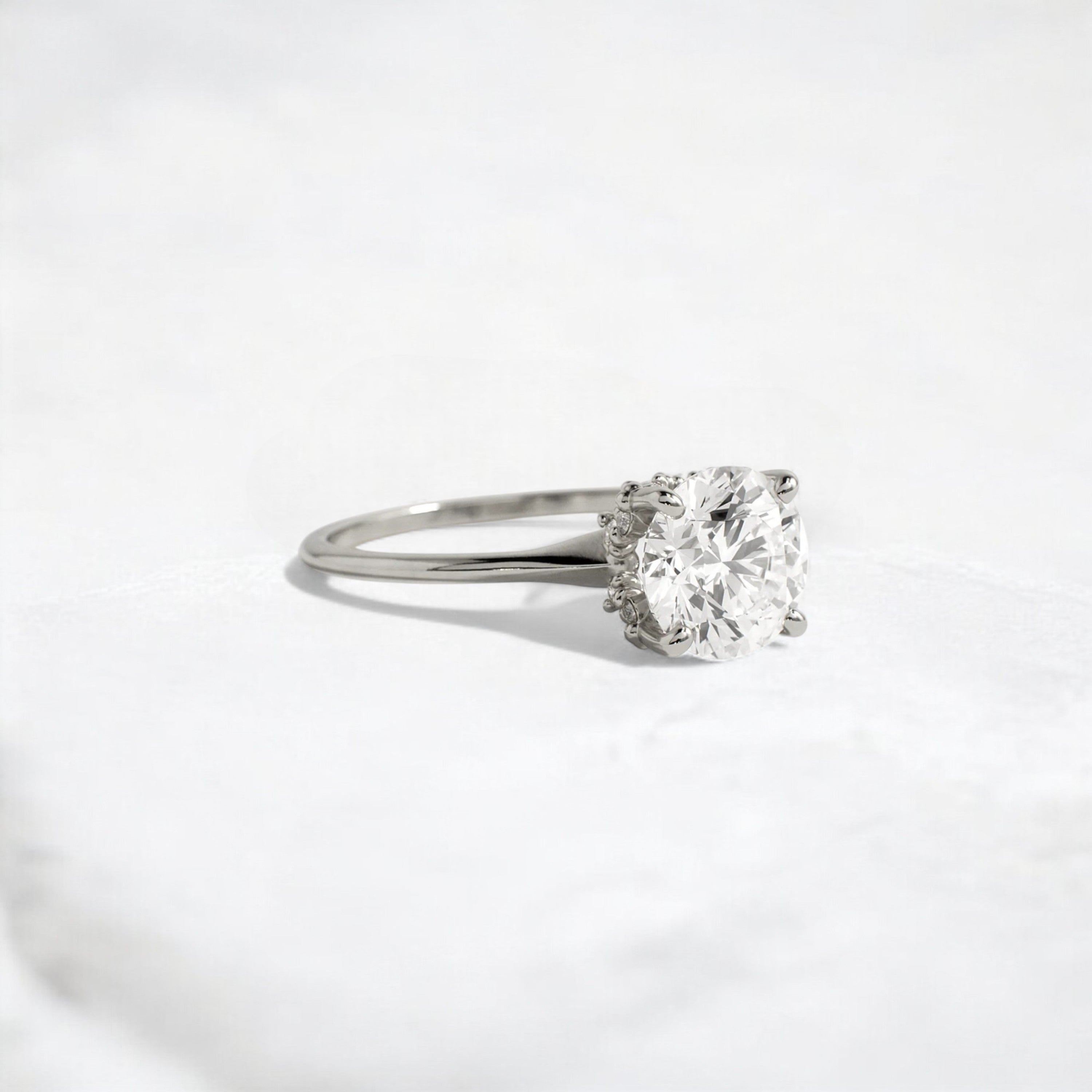 whispering-aurora-round-v-embrace-solitaire-engagement-ring-2-ct-platinum-gemfora-2