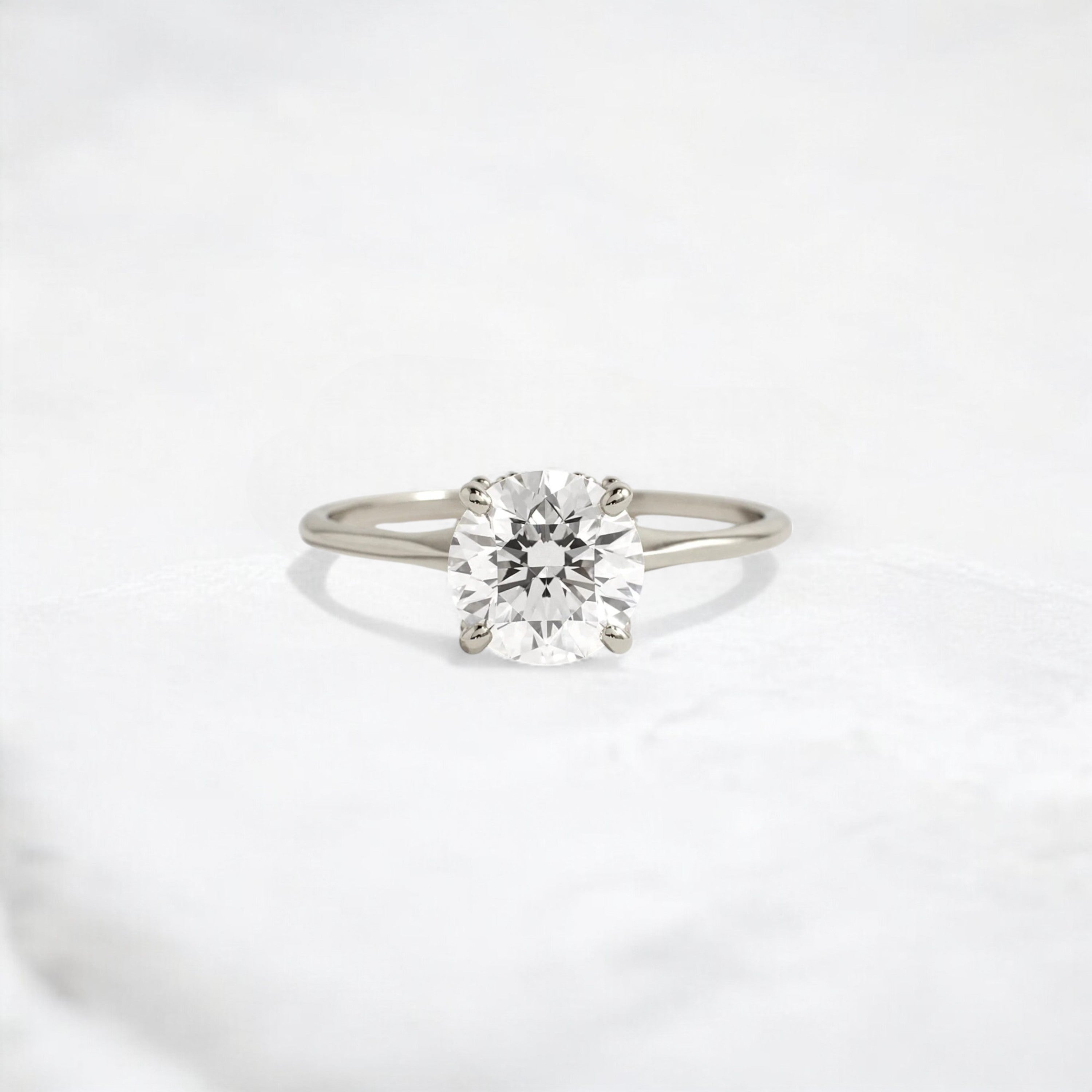 whispering-aurora-round-v-embrace-solitaire-engagement-ring-2-ct-white-gold-gemfora-1