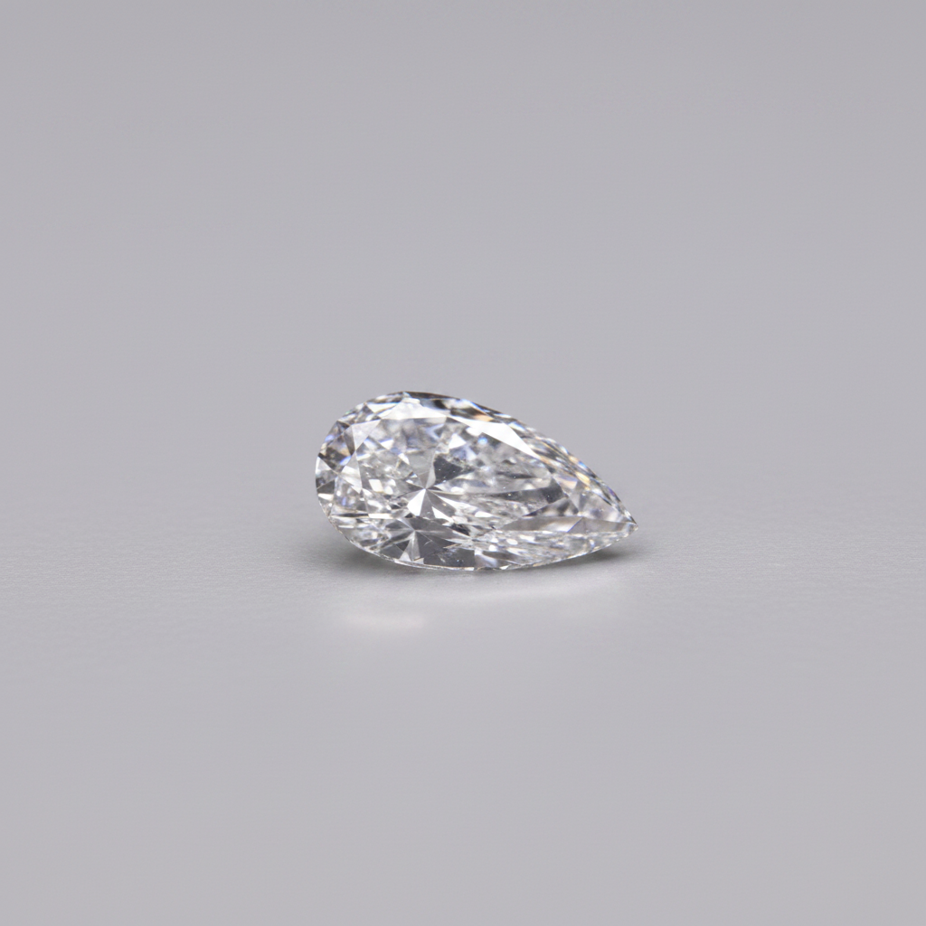Pear-shaped diamond on a gray background