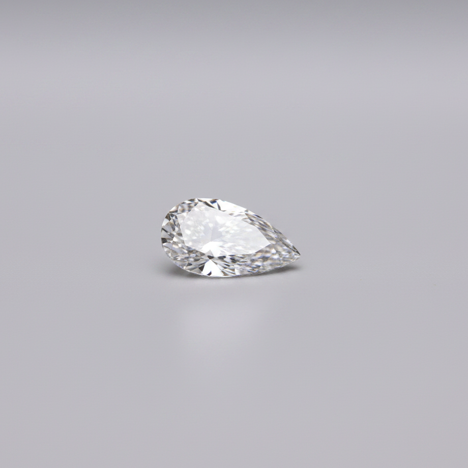 Pear-shaped diamond on a gray background