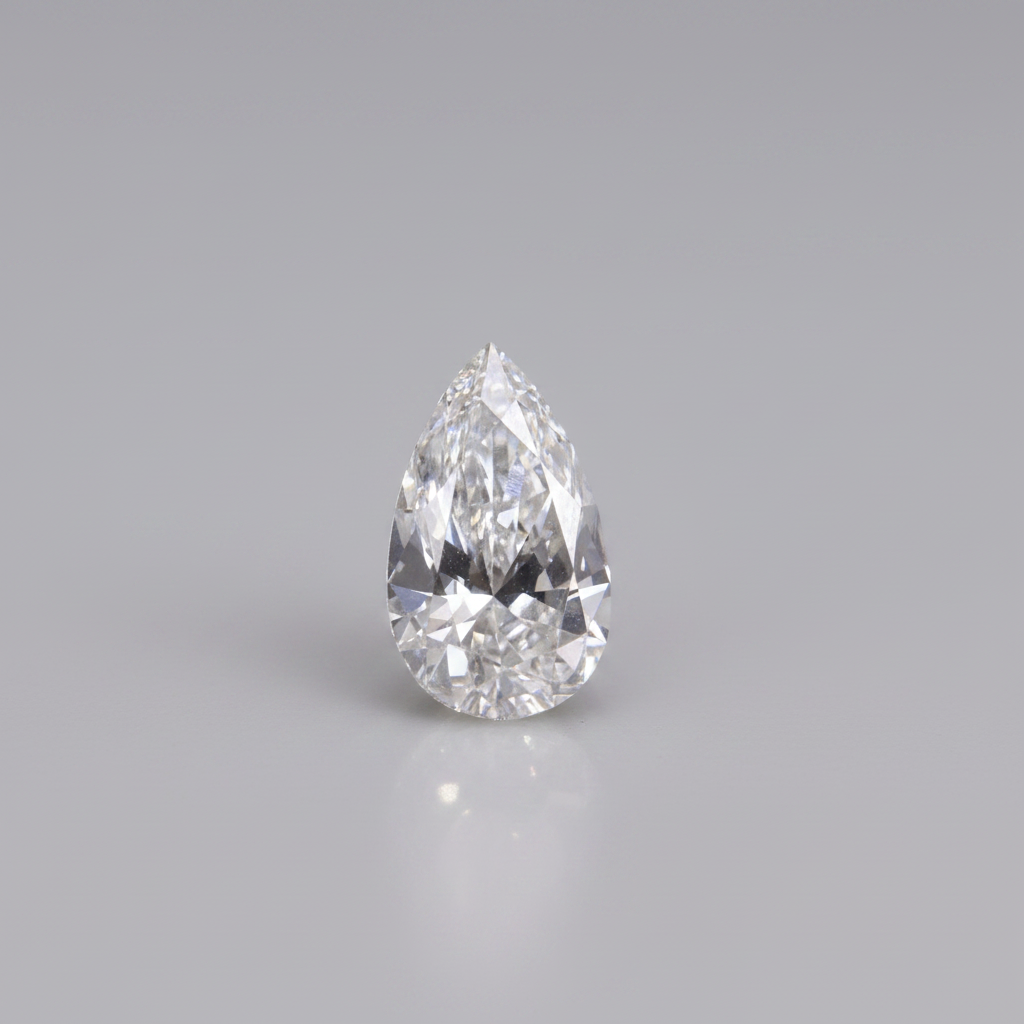 Teardrop-shaped diamond on a gray background