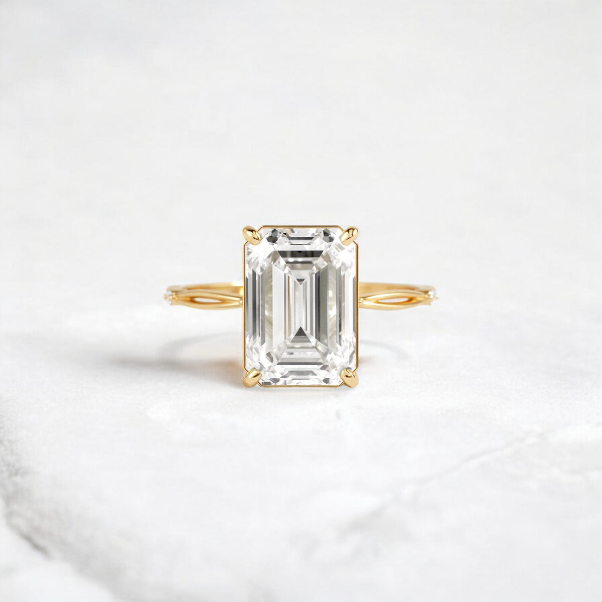 emerald-cut-engagement-ring-classic-crossed-moissanite-band-4-ct-yellow-gold-gemfora-1
