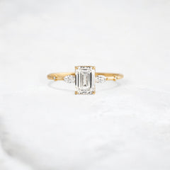 emerald-embrace-moissanite-engagement-solitaire-love-ring-1-20-ct-yellow-gold-gemfora-1