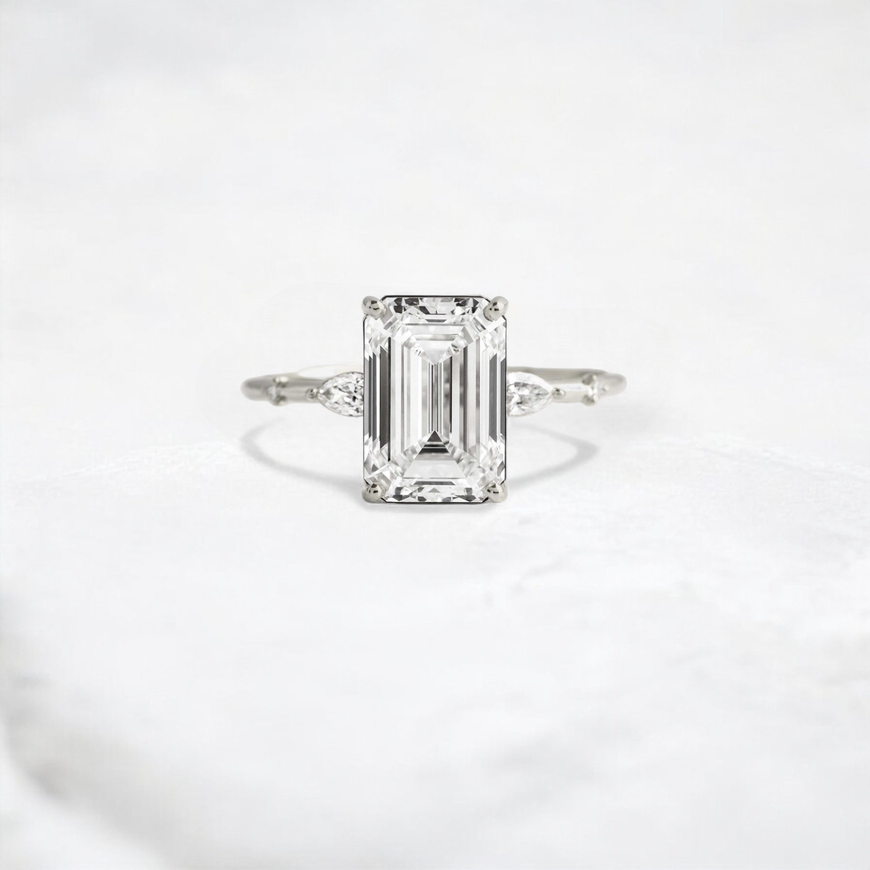 emerald-embrace-moissanite-engagement-solitaire-love-ring-2-70-ct-platinum-gemfora-1
