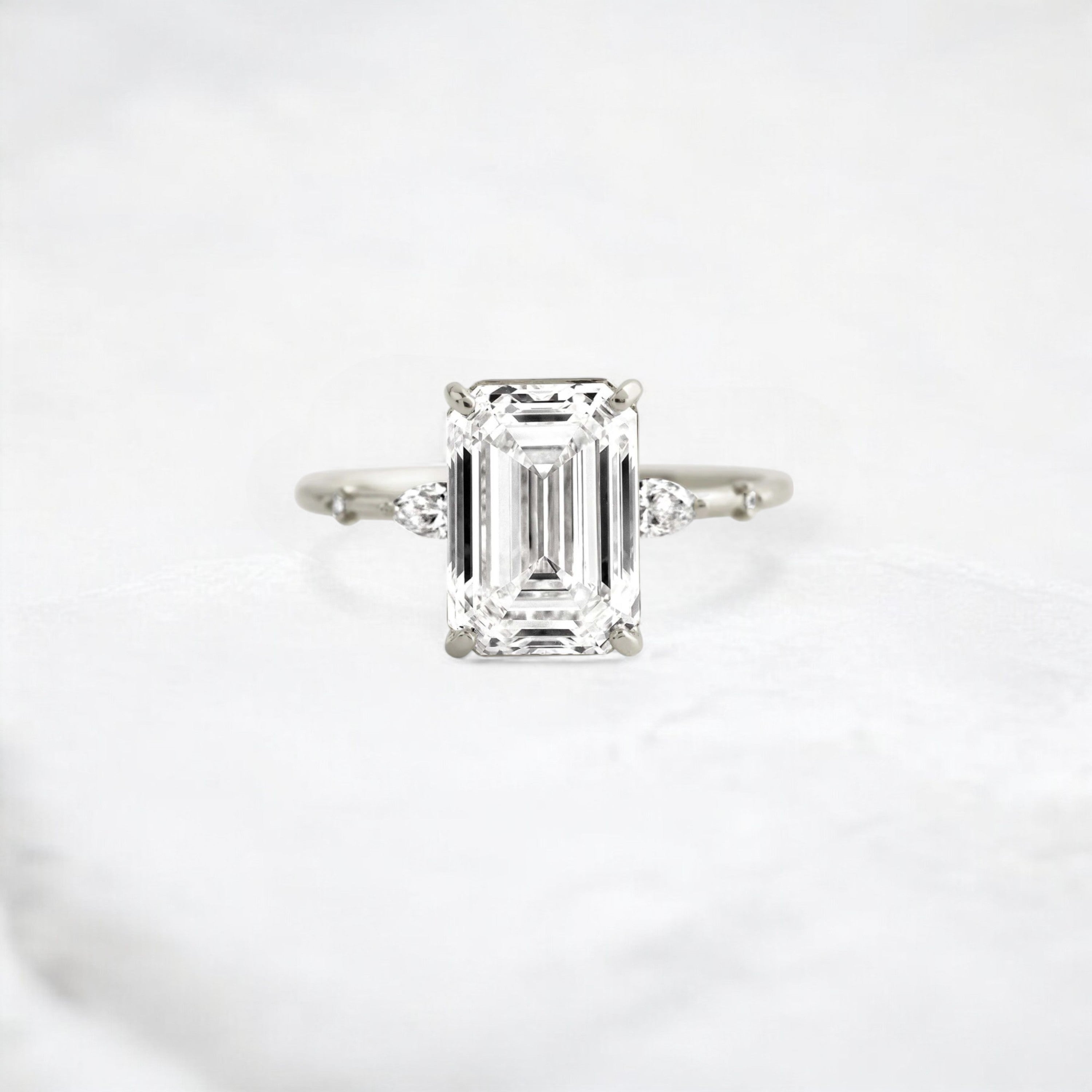 emerald-embrace-moissanite-engagement-solitaire-love-ring-3-5-ct-platinum-gemfora-1