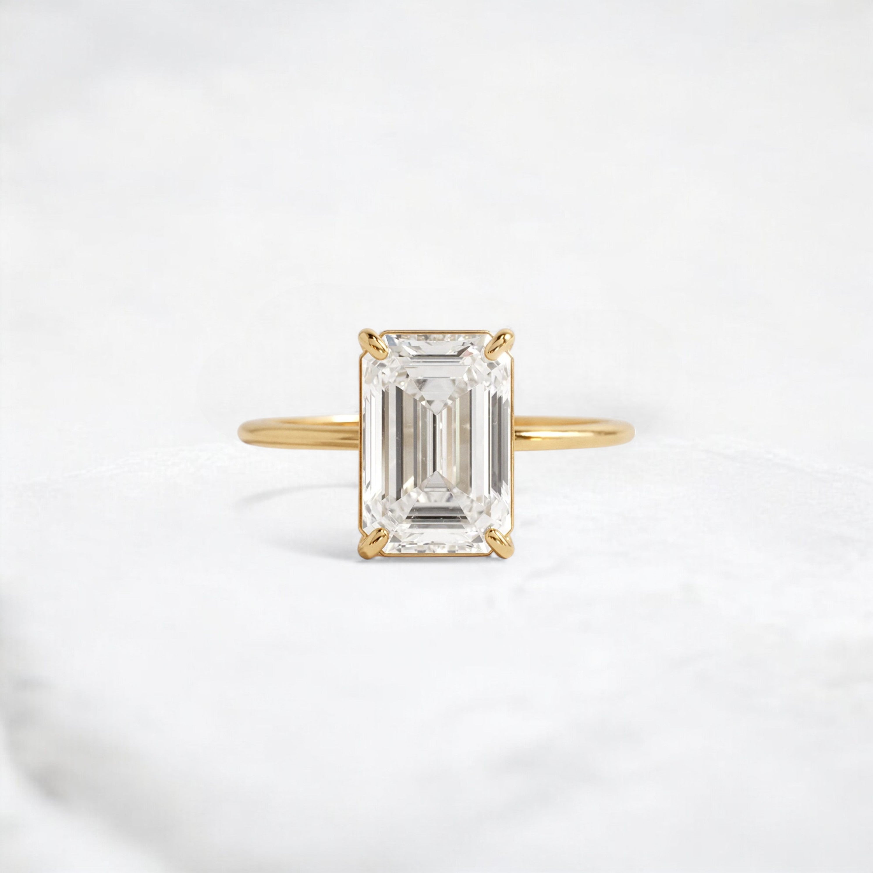 eternal-grace-emerald-solitaire-moissanite-engagement-ring-3-ct-yellow-gold-gemfora-1