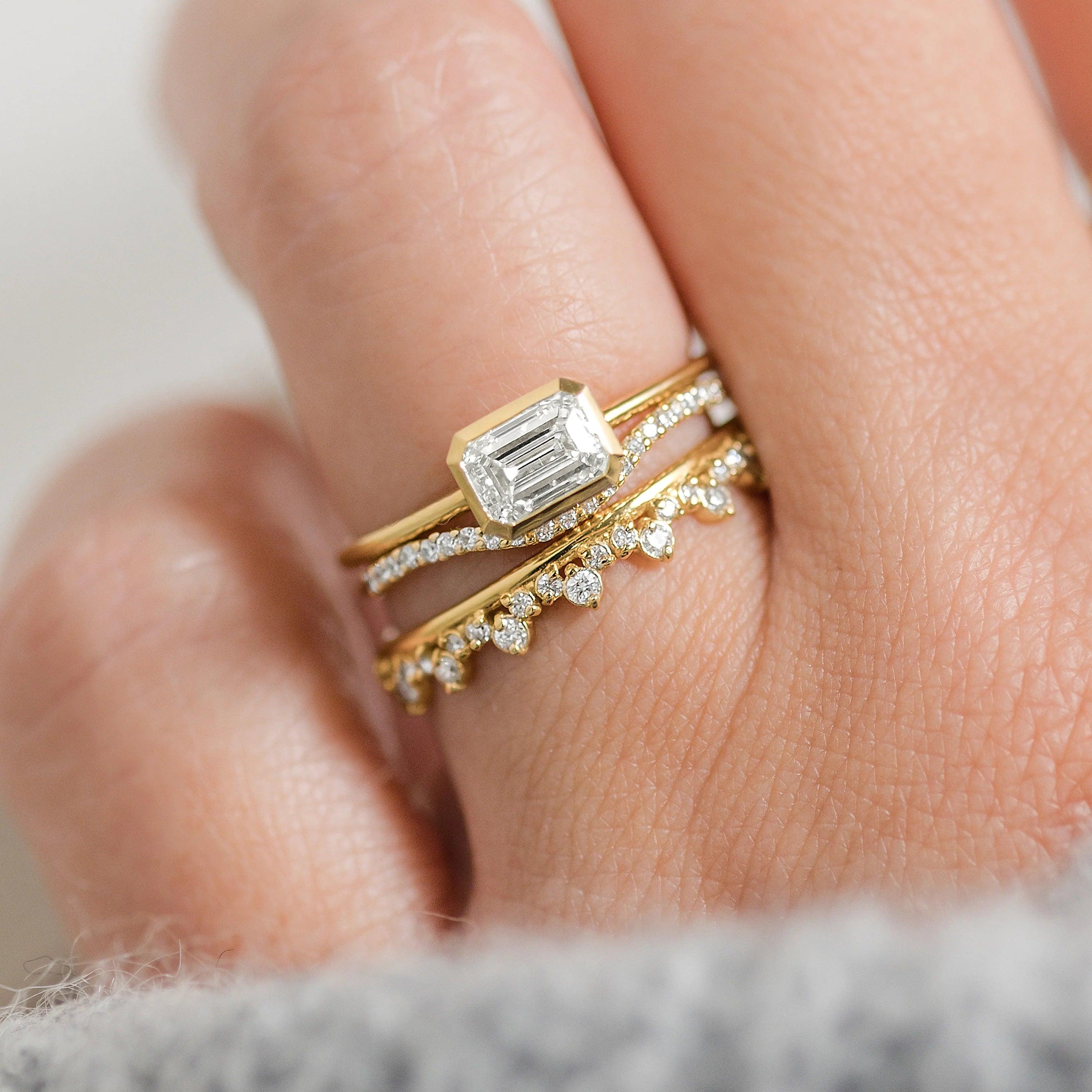 Elegant handmade emerald cut diamond engagement ring, featuring a bezel setting designed for women.
