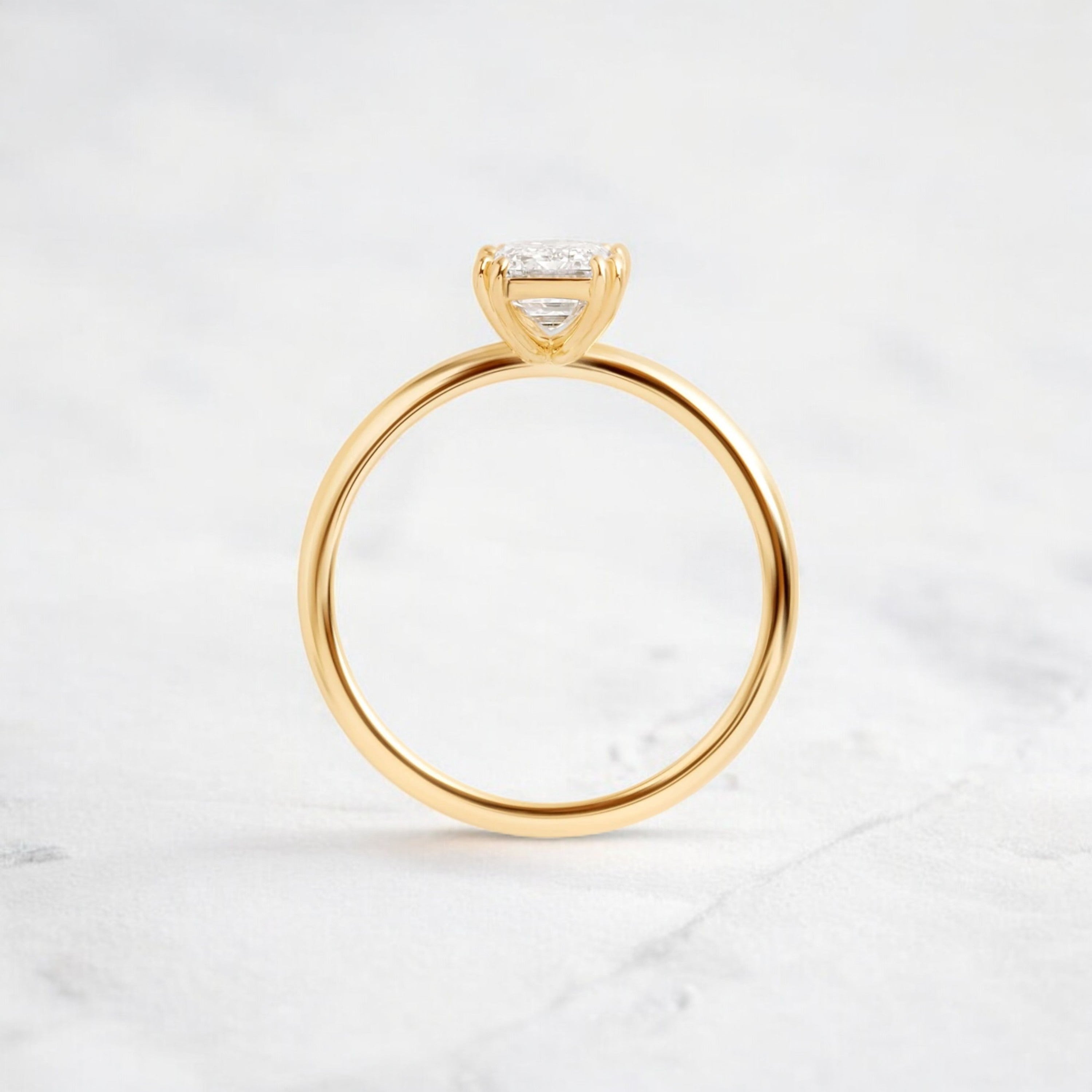 handmade-double-prong-emerald-solitaire-moissanite-engagement-ring-0-90-ct-yellow-gold-gemfora