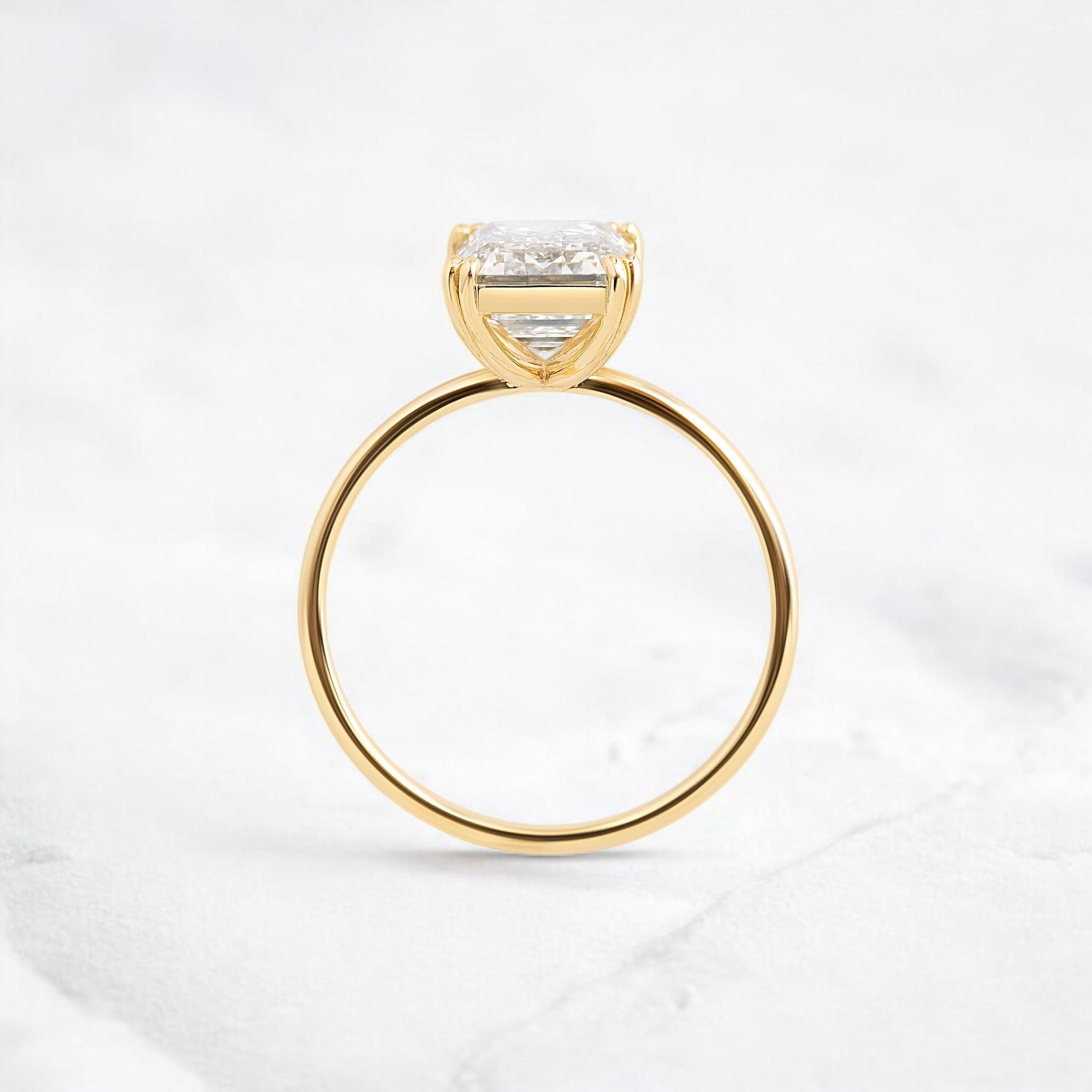 handmade-double-prong-emerald-solitaire-moissanite-engagement-ring-3-05-ct-yellow-gold-gemfora