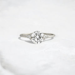 handmade-round-cut-1.14ct-moissanite-engagement-ring-with-closed-basket-and-two-tab-prongs-platinum-gemfora-1