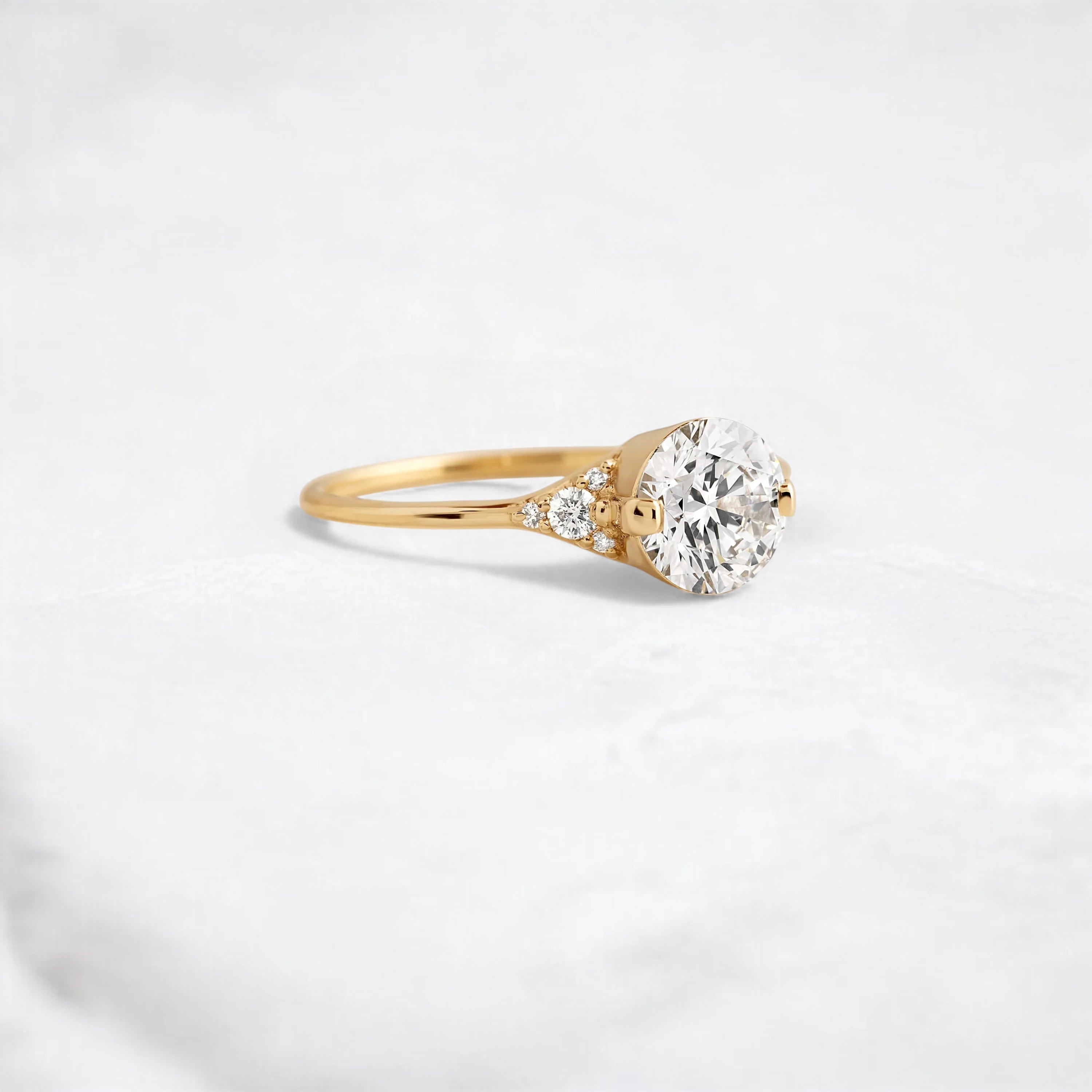 handmade-round-cut-1.14ct-moissanite-engagement-ring-with-closed-basket-and-two-tab-prongs-yellow-gold-gemfora-2