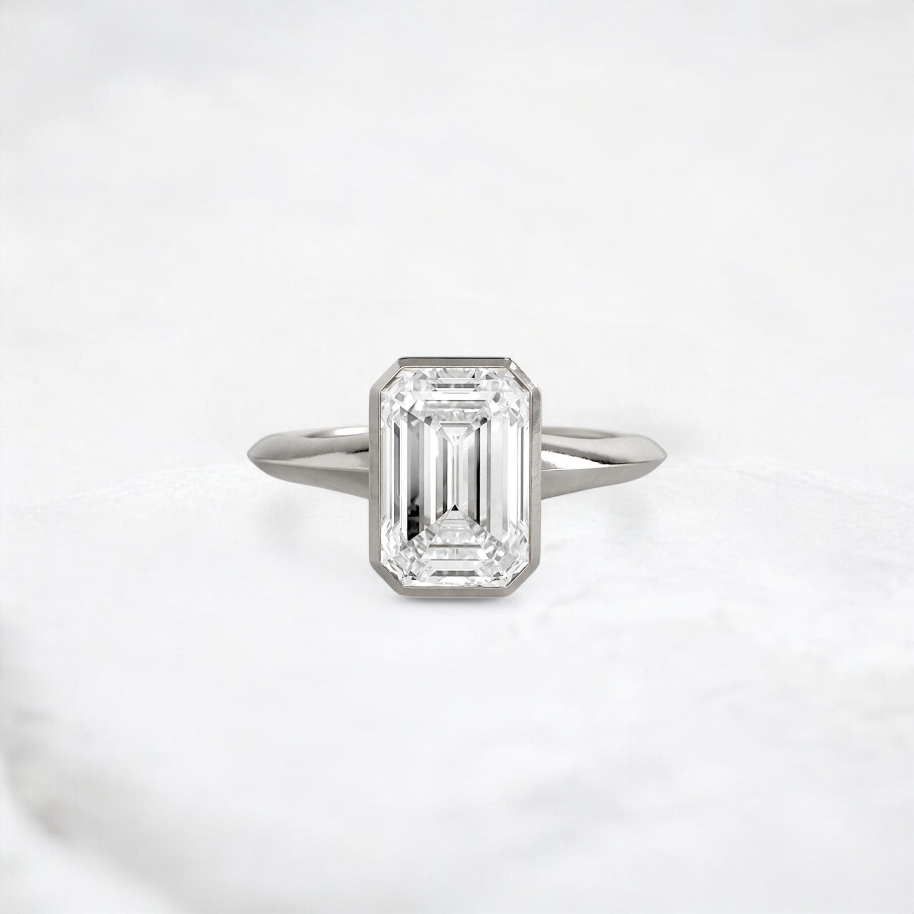 hidden-muse-emerald-glow-bezel-moissanite-engagement-ring-3-ct-platinum-gemfora-1