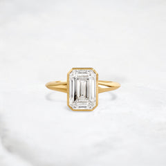 hidden-muse-emerald-glow-bezel-moissanite-engagement-ring-3-ct-yellow-gemfora-1