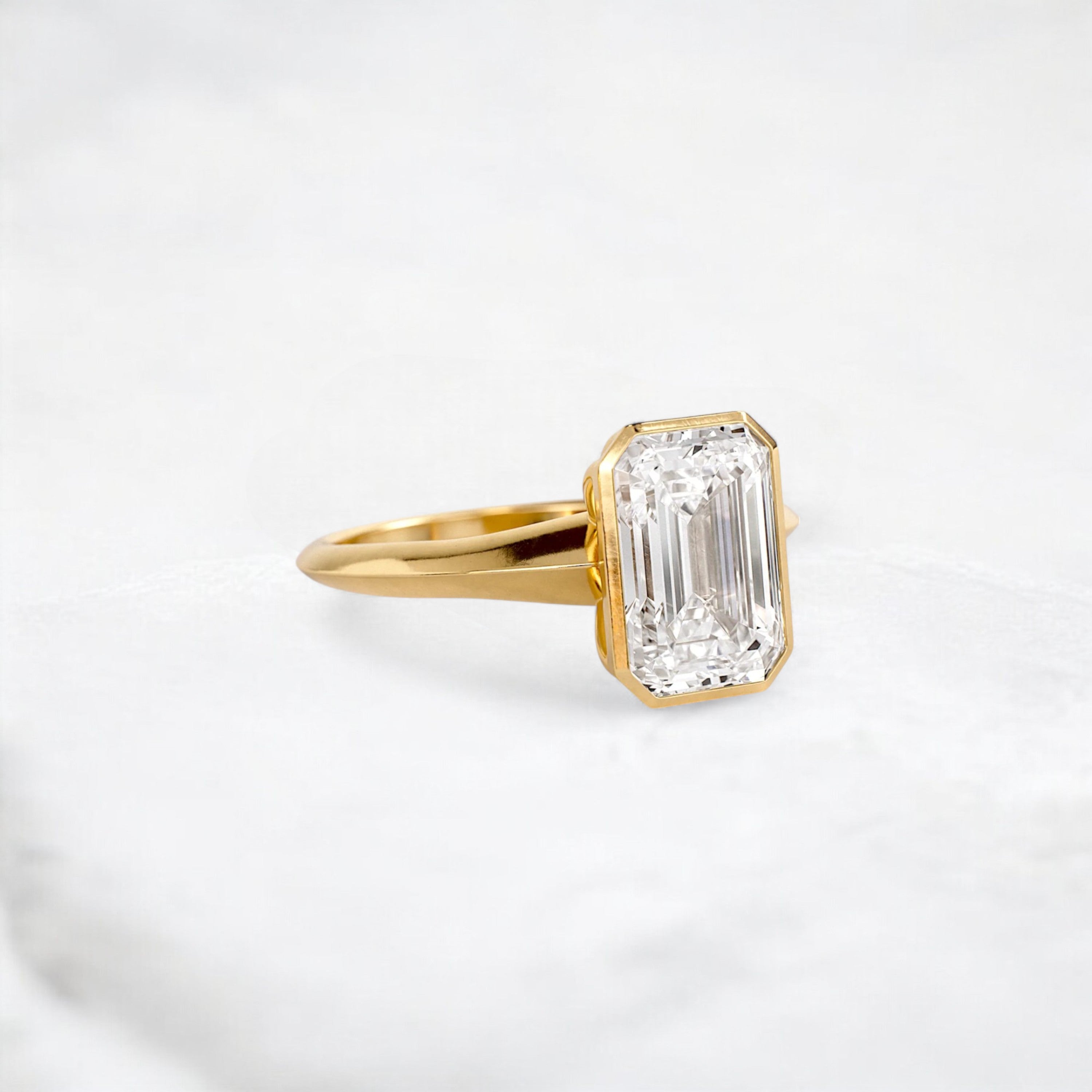 hidden-muse-emerald-glow-bezel-moissanite-engagement-ring-3-ct-yellow-gold-gemfora-2