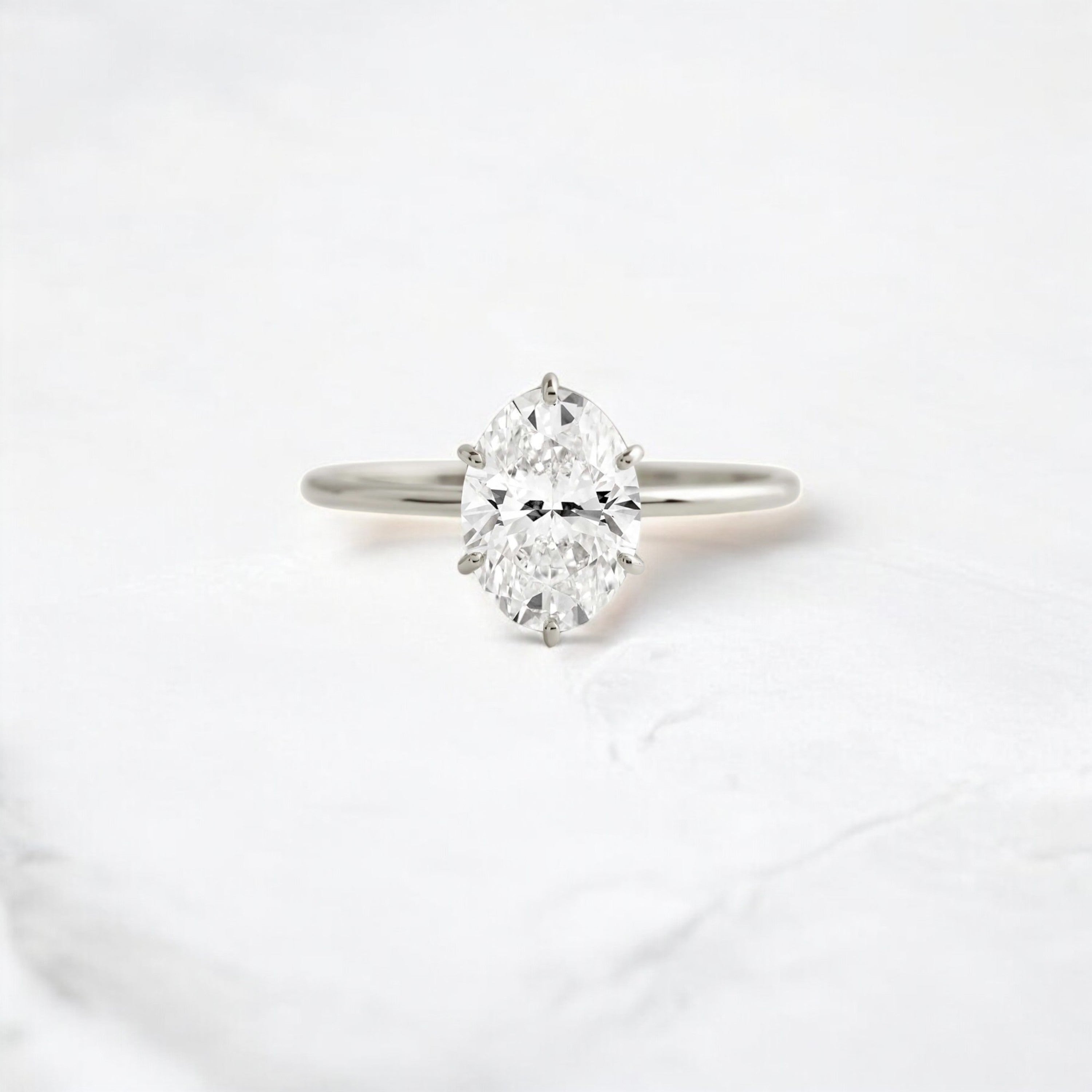 moissanite-1-33-ct-oval-cut-solitaire-handcrafted-platinum-engagement-ring-gemfora