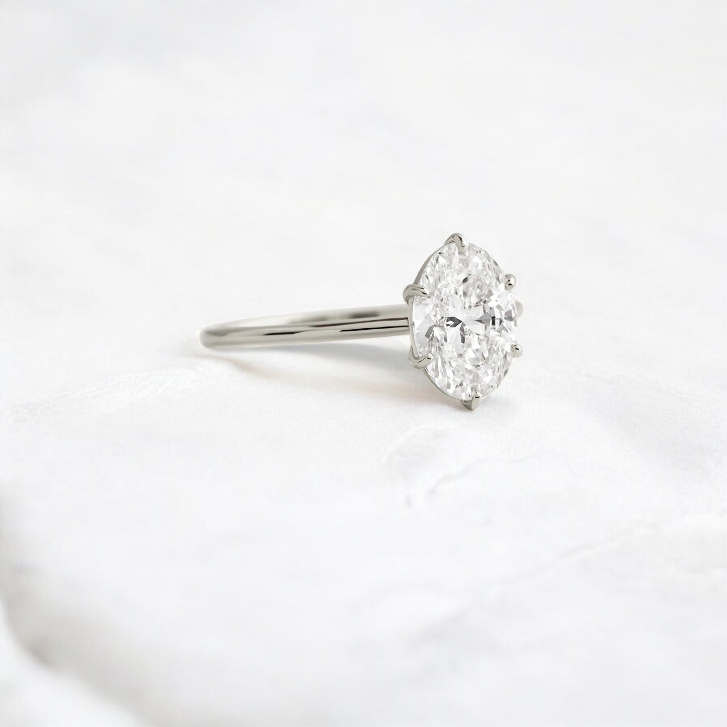 moissanite-1-33-ct-oval-cut-solitaire-handcrafted-platinum-engagement-ring-gemfora