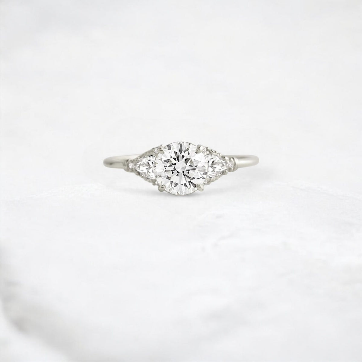 Three Stone Petal Round Moissanite Engagement Ring, Pear Side Accented