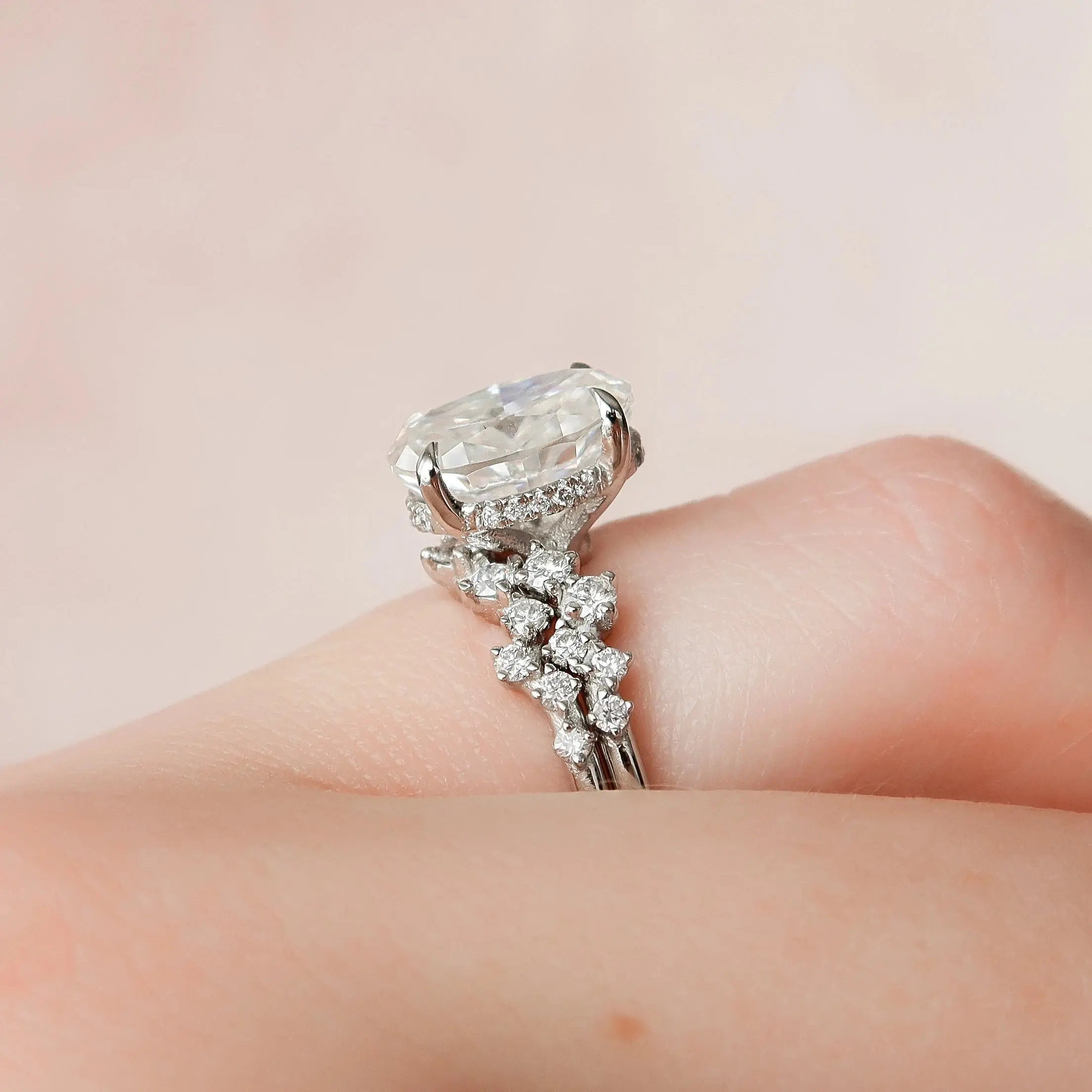 Oval cut moissanite halo ring close up