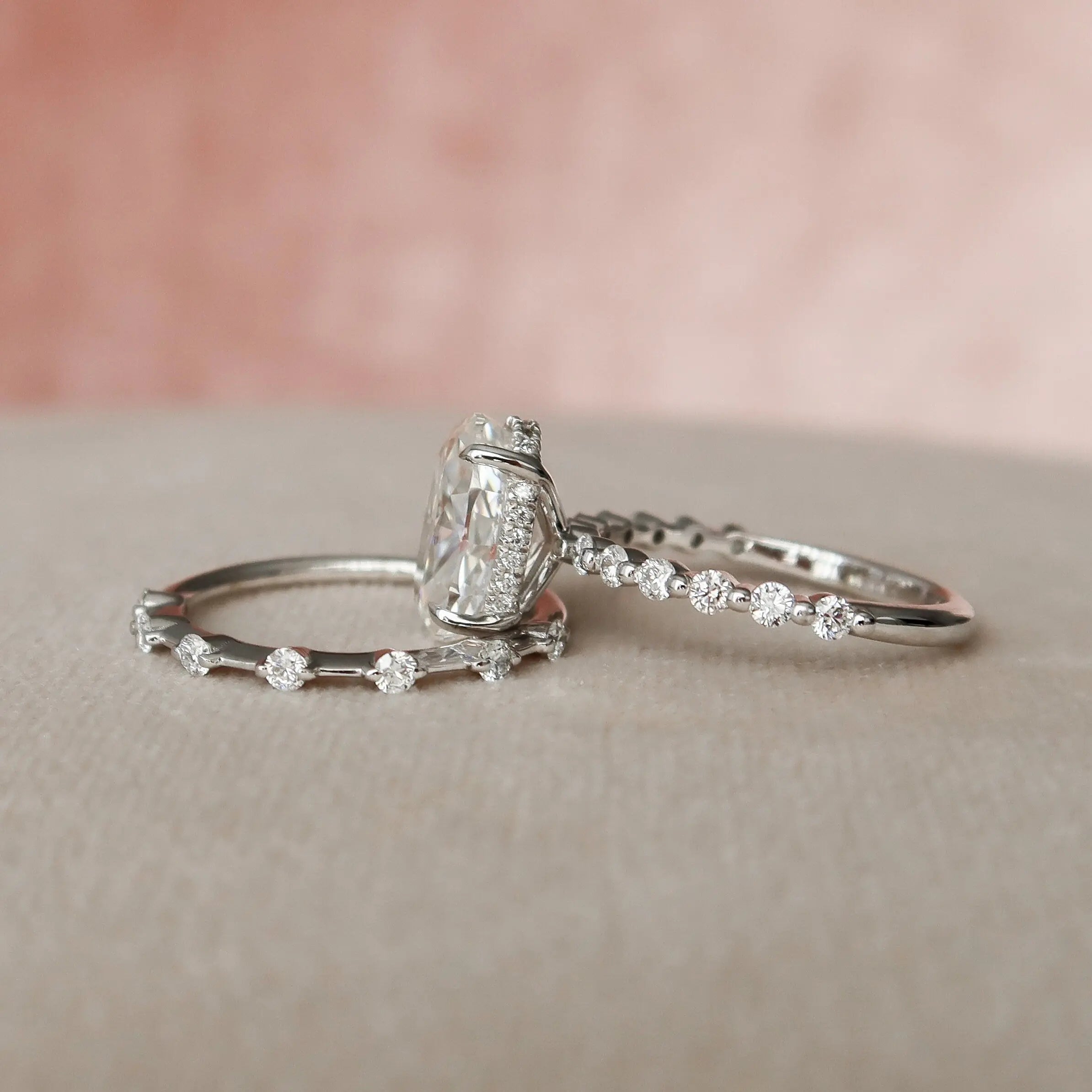 Oval moissanite engagement ring with round side stones