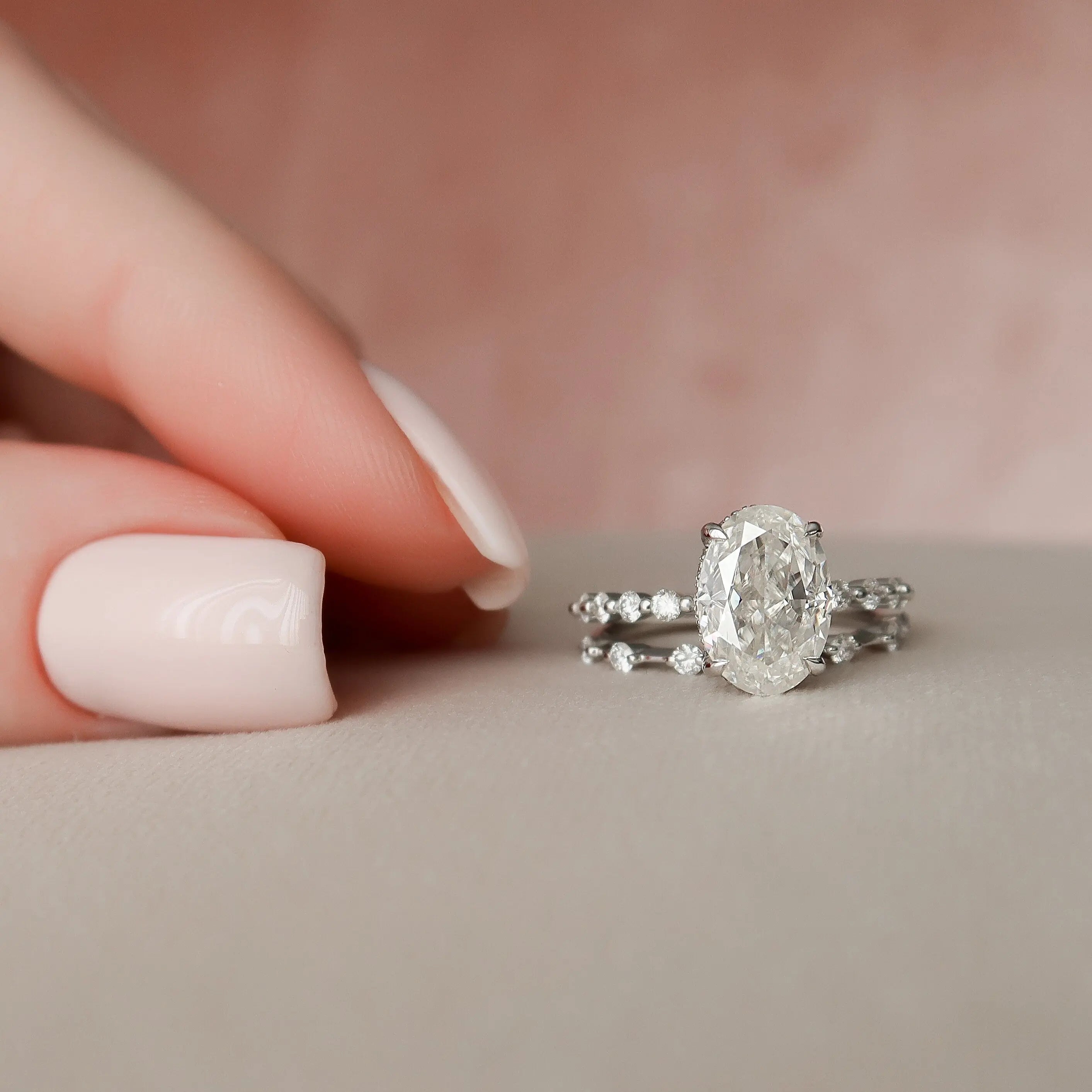 Oval moissanite halo engagement ring close up