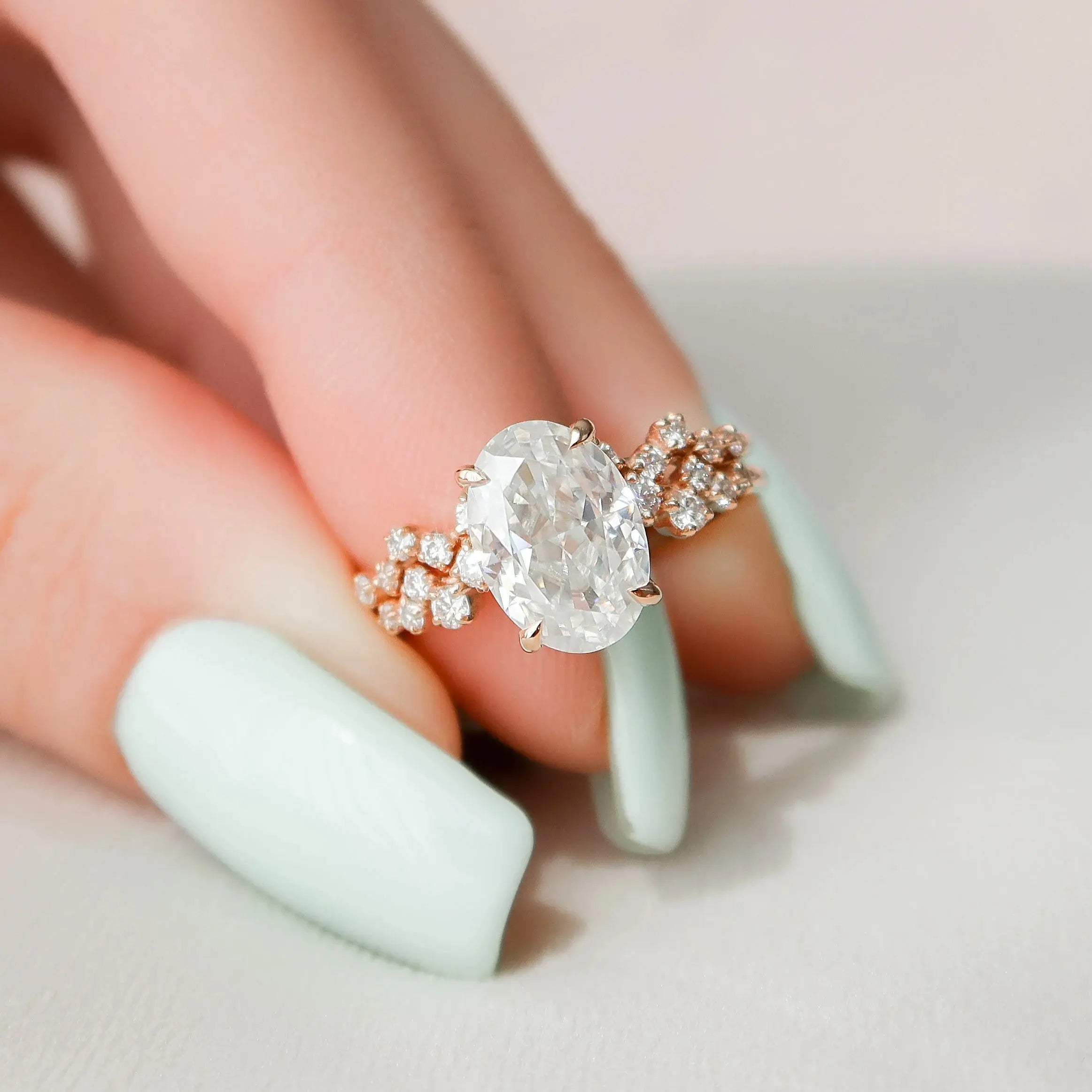 Oval moissanite halo engagement ring side view