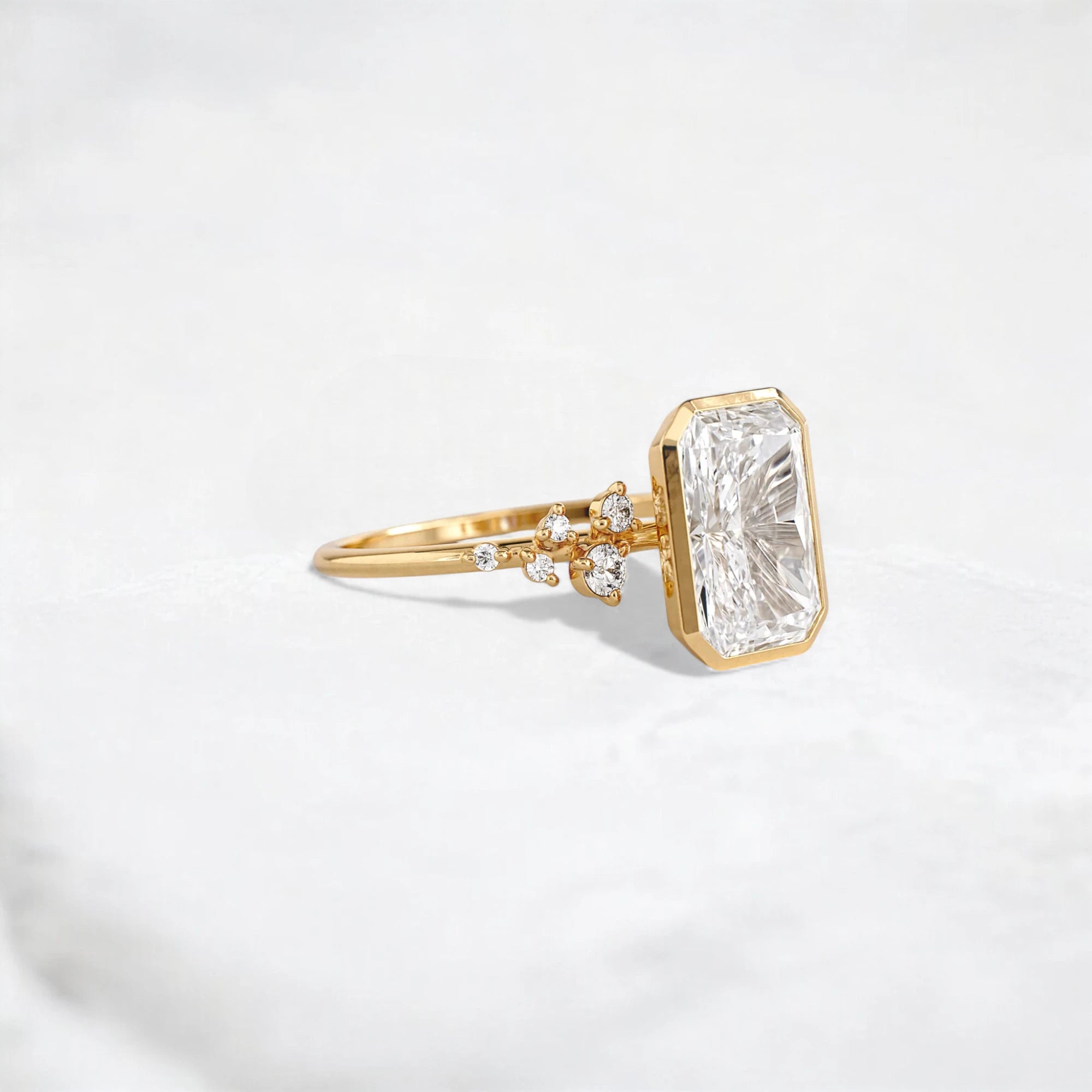 radiant-cut-2ct-bezel-with-cluster-engagement-ring-3