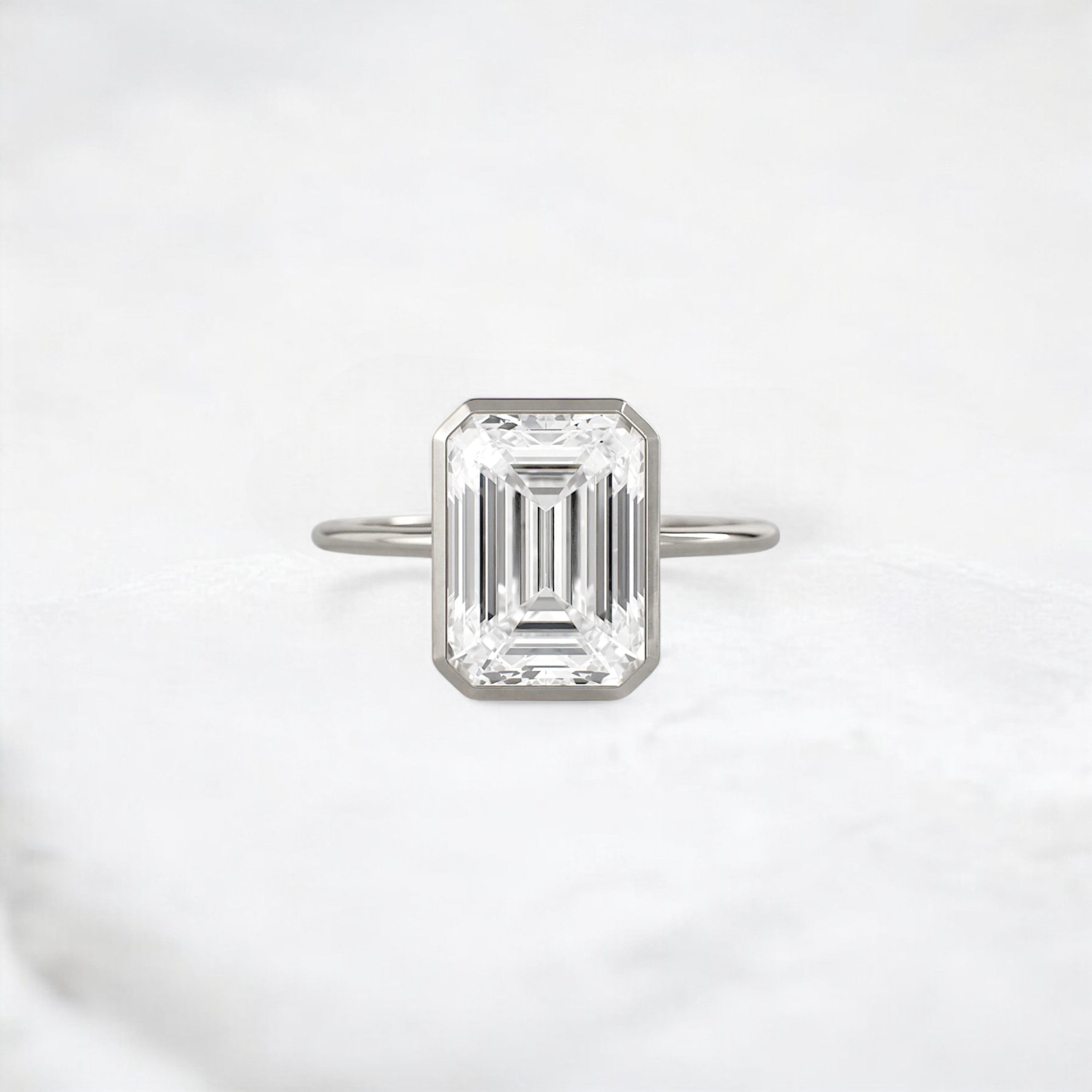 secret-glimmer-emerald-cut-bezel-moissanite-engagement-ring-4-ct-platinum-gemfora-1