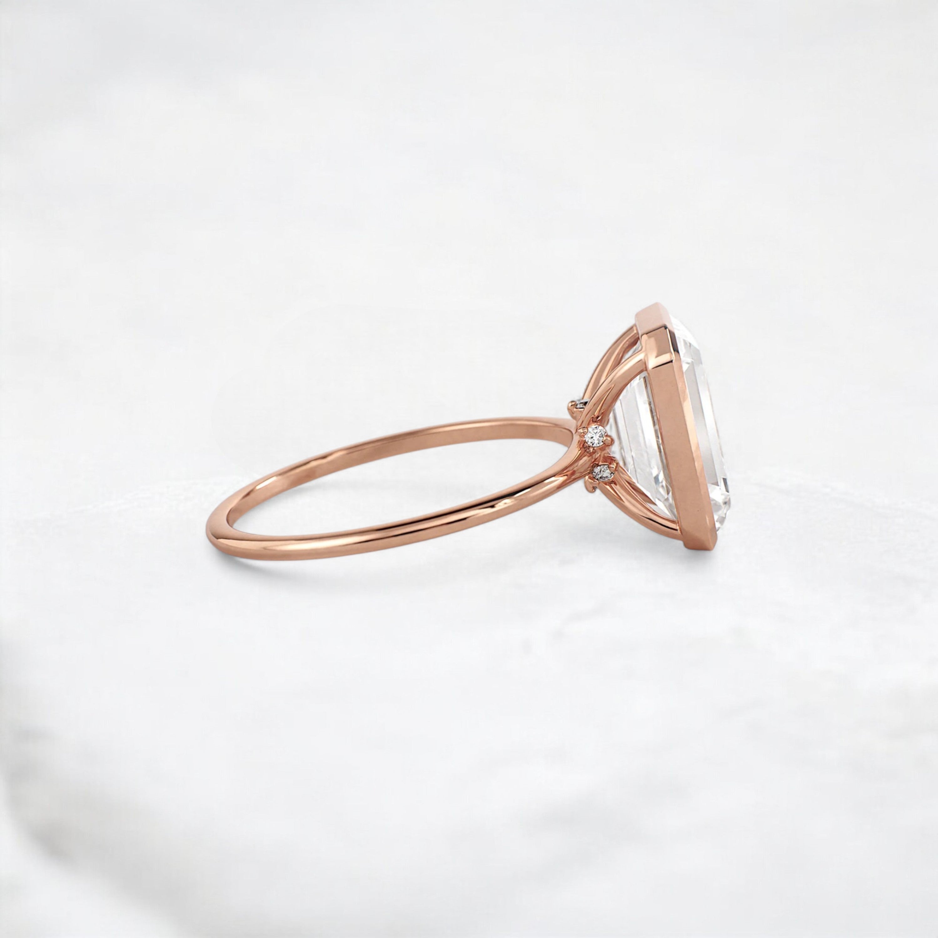 secret-glimmer-emerald-cut-bezel-moissanite-engagement-ring-4-ct-rose-gold-gemfora-3