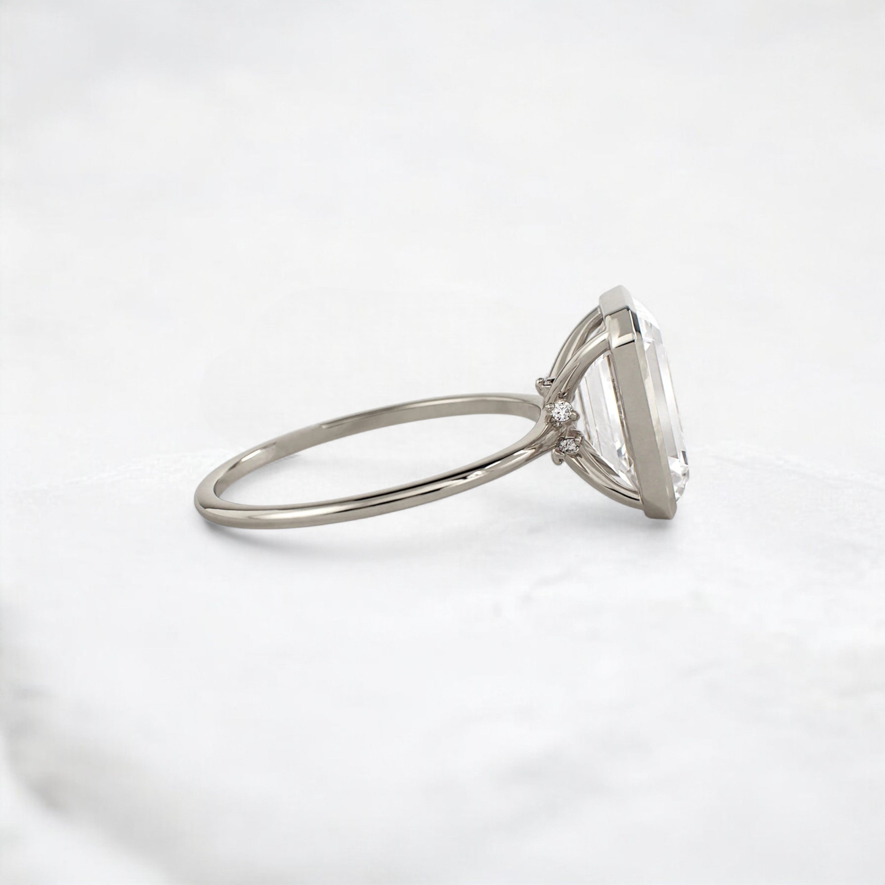 secret-glimmer-emerald-cut-bezel-moissanite-engagement-ring-4-ct-white-gold-gemfora-3