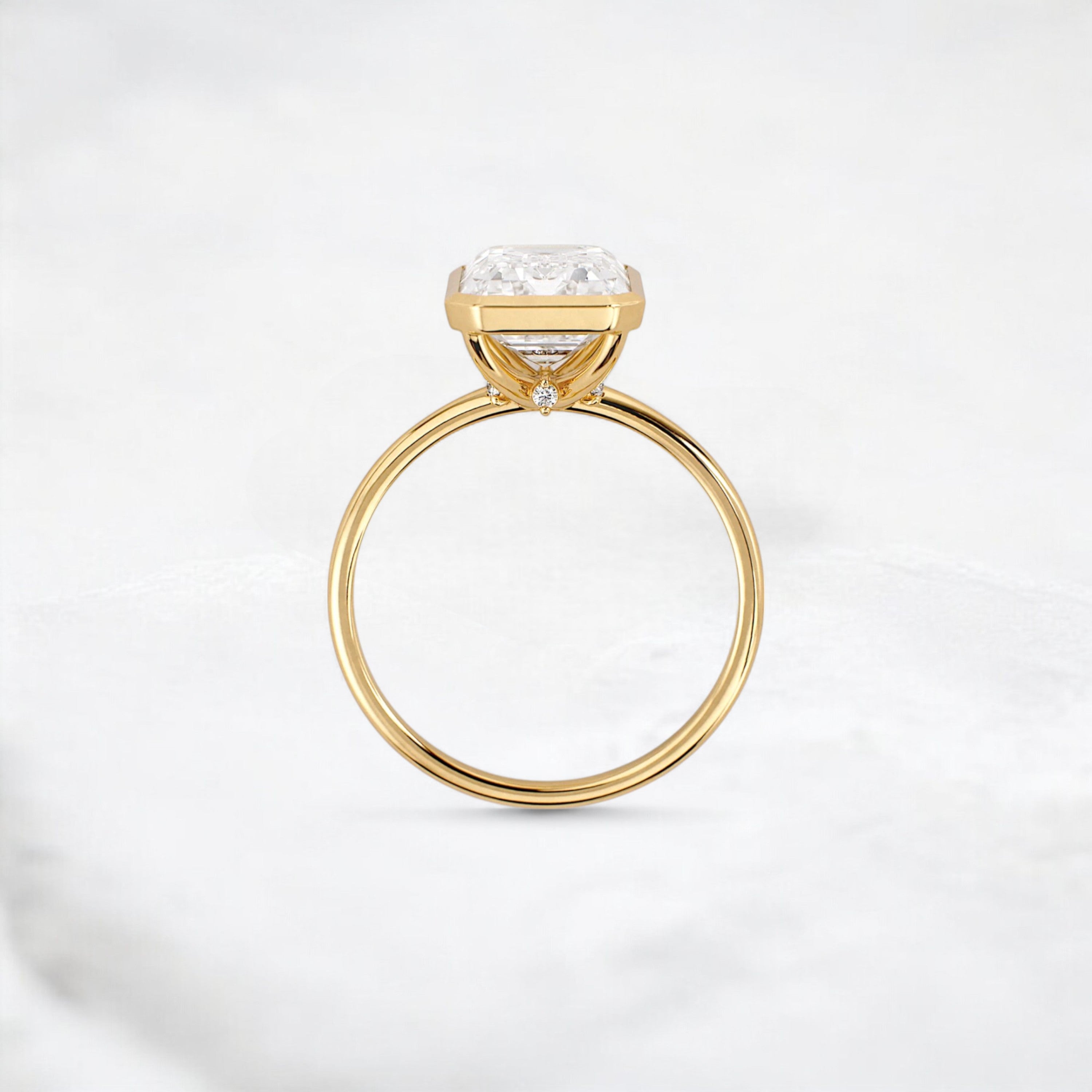 secret-glimmer-emerald-cut-bezel-moissanite-engagement-ring-4-ct-yellow-gold-gemfora-4