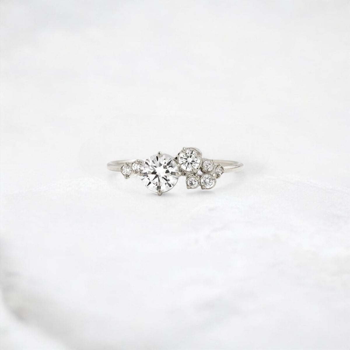 side-serenade-round-cut-harmony-moissanite-engagement-ring-0-50-ct-platinum-gemfora-1