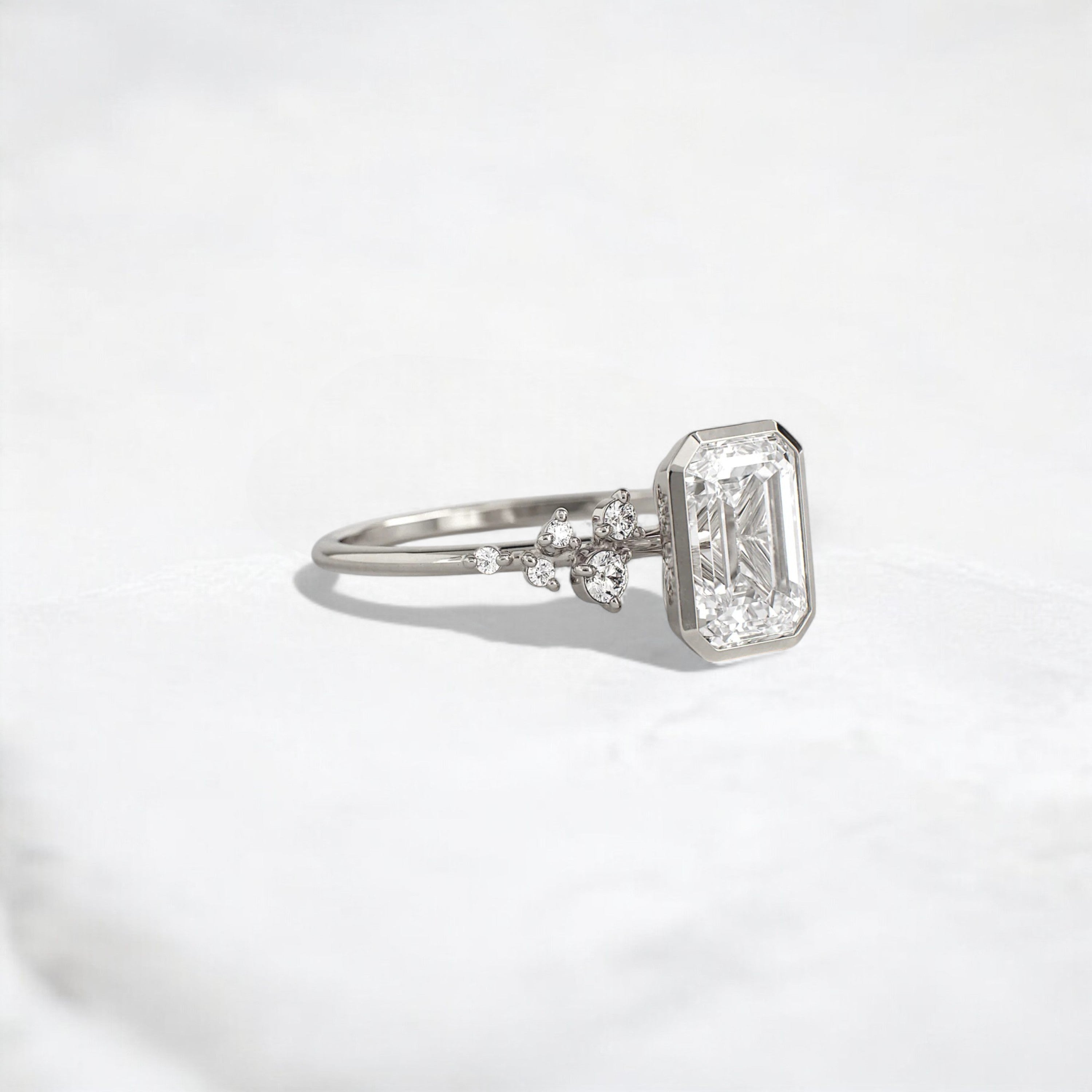 silent-luster-emerald-cluster-bezel-moissanite-engagement-ring-1-ct-platinum-gemfora-2