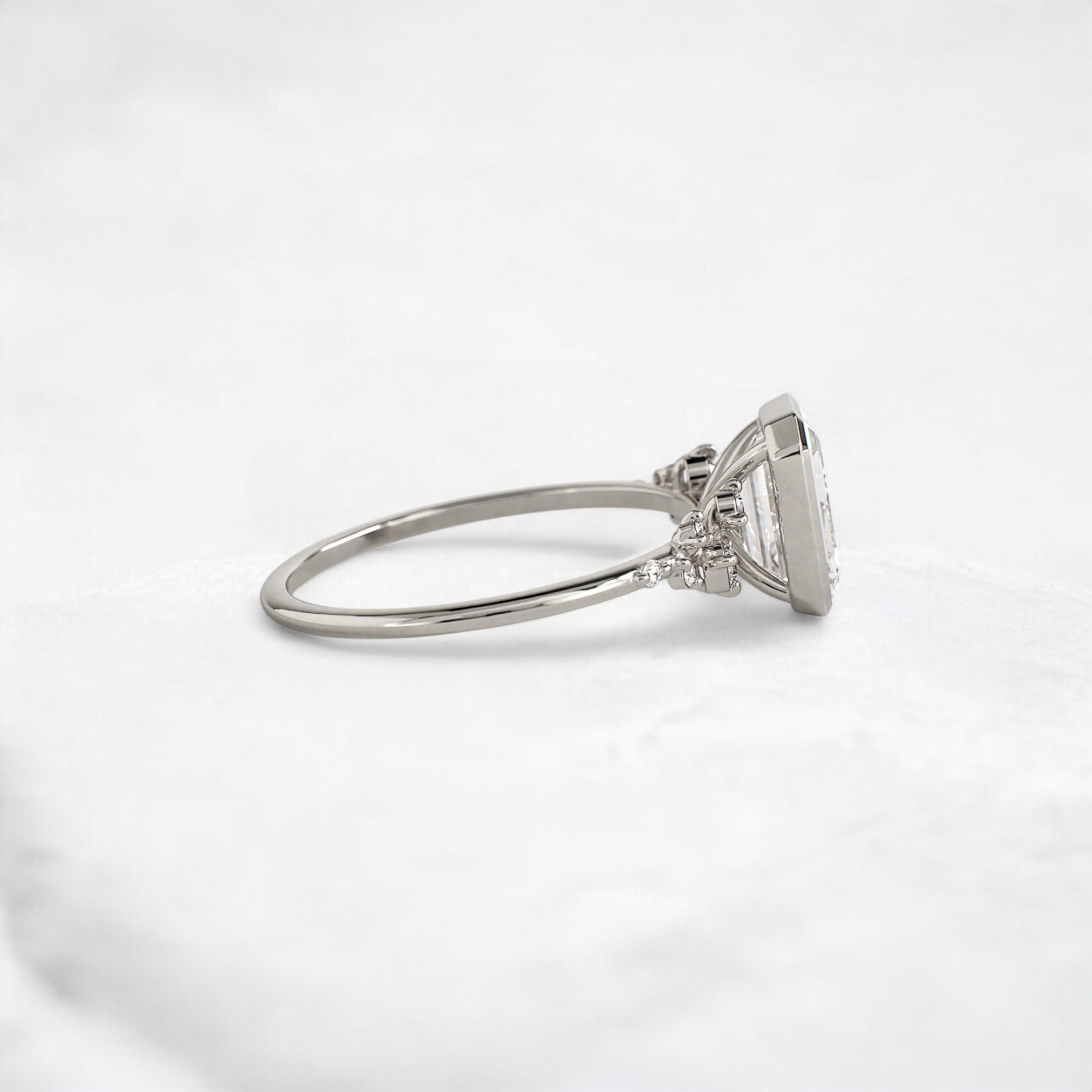 silent-luster-emerald-cluster-bezel-moissanite-engagement-ring-1-ct-platinum-gemfora-3