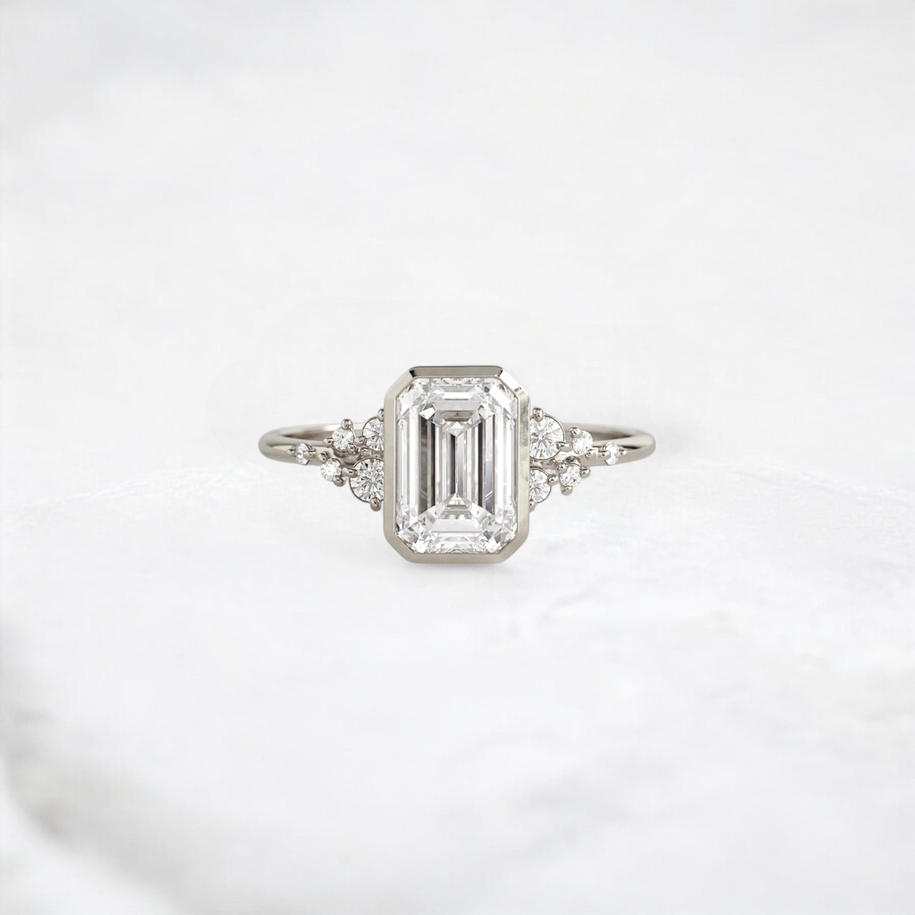 silent-luster-emerald-cluster-bezel-moissanite-engagement-ring-1-ct-white-gold-gemfora-1