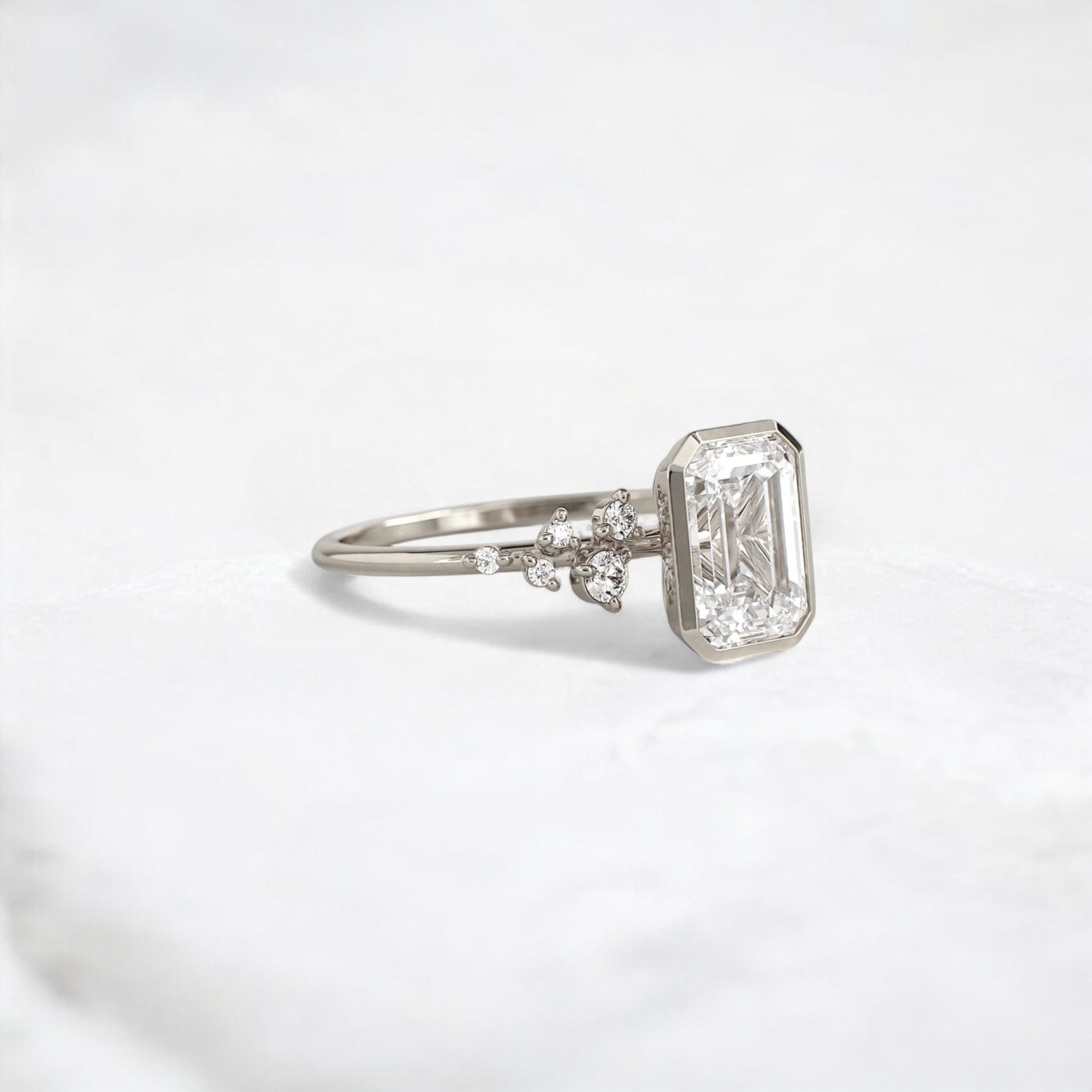 silent-luster-emerald-cluster-bezel-moissanite-engagement-ring-1-ct-white-gold-gemfora-2
