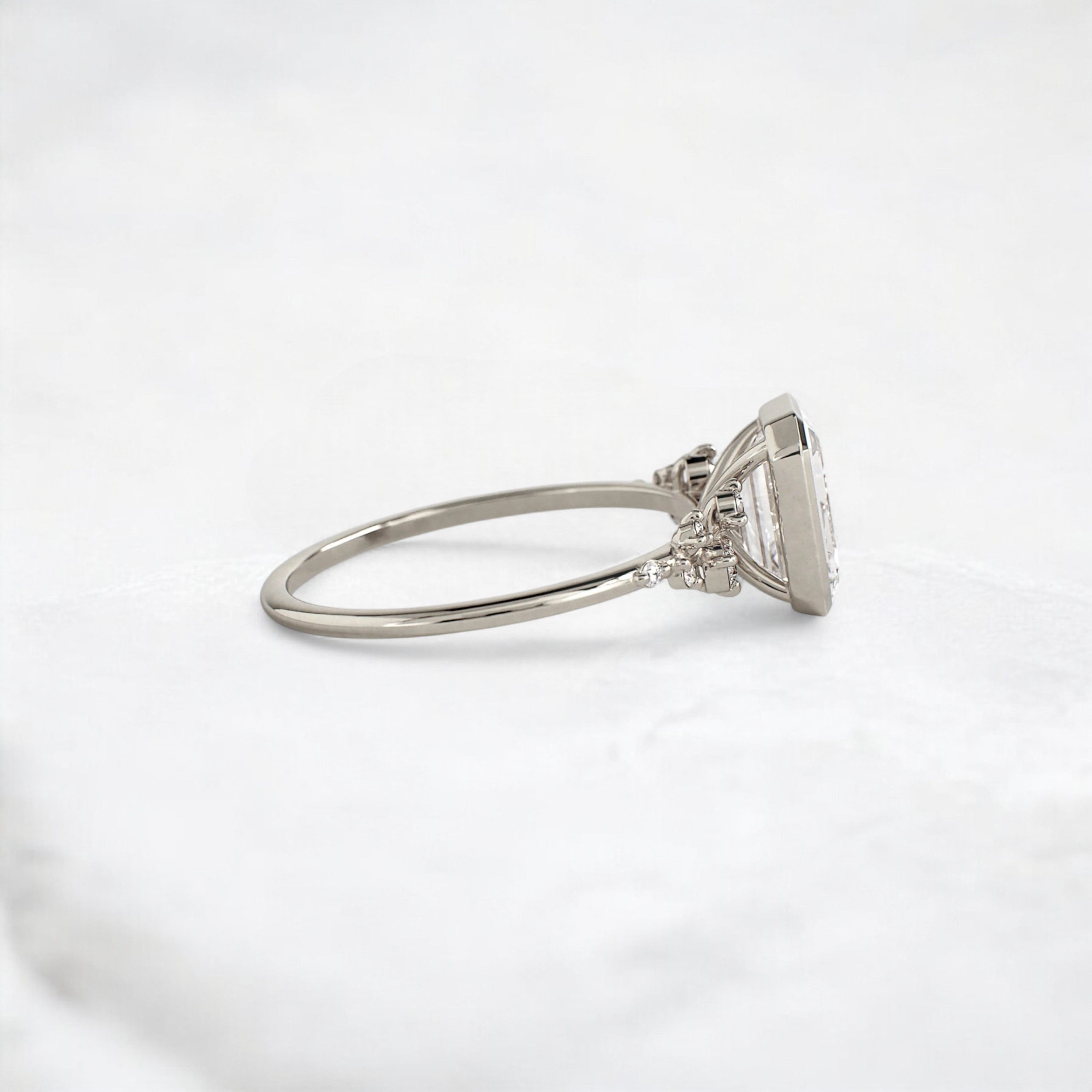 silent-luster-emerald-cluster-bezel-moissanite-engagement-ring-1-ct-white-gold-gemfora-3