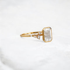 silent-luster-emerald-cluster-bezel-moissanite-engagement-ring-1-ct-yellow-gold-gemfora-2