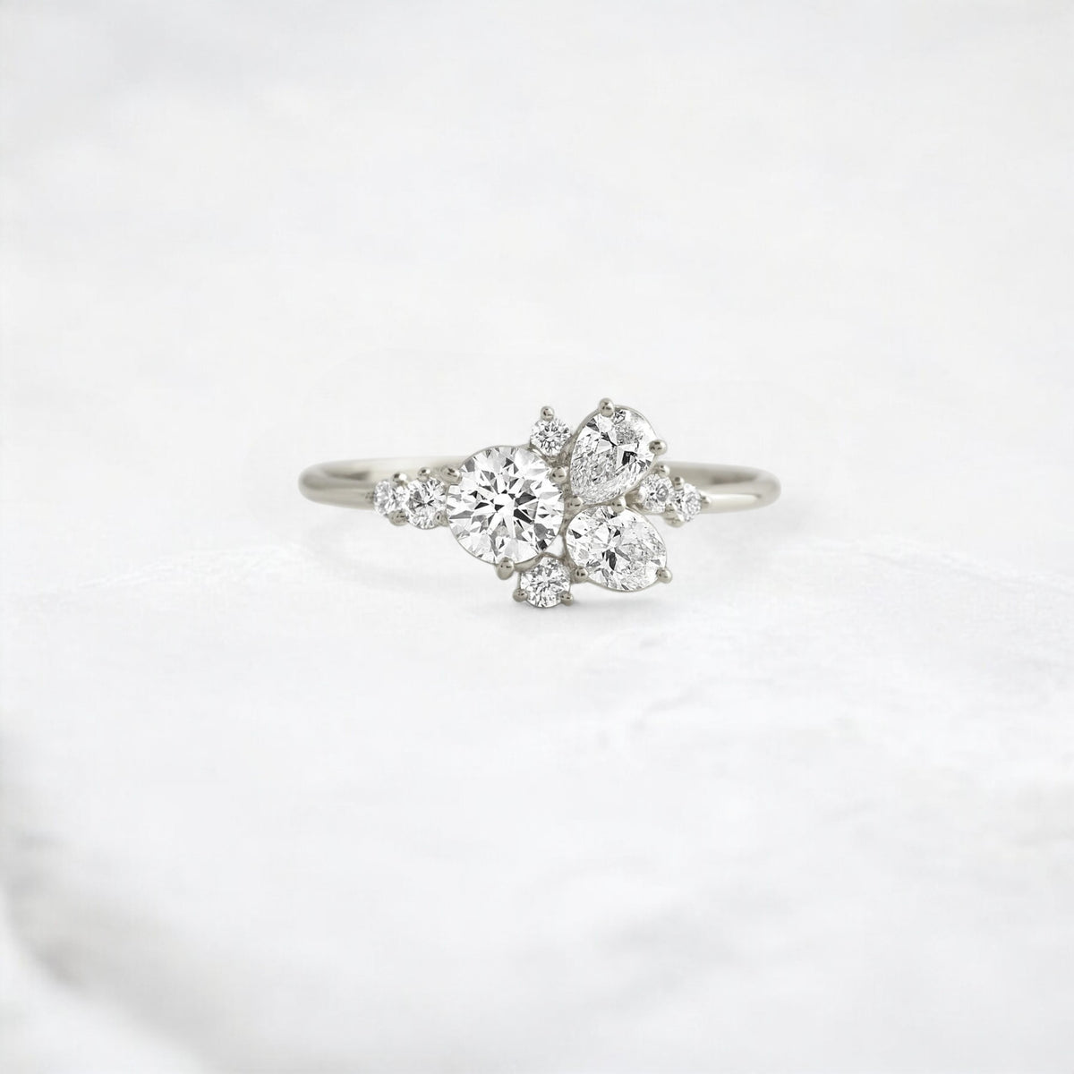 starpetal-whispers-round-cluster-love-engagement-ring-0-30-ct-platinum-gemfora-1