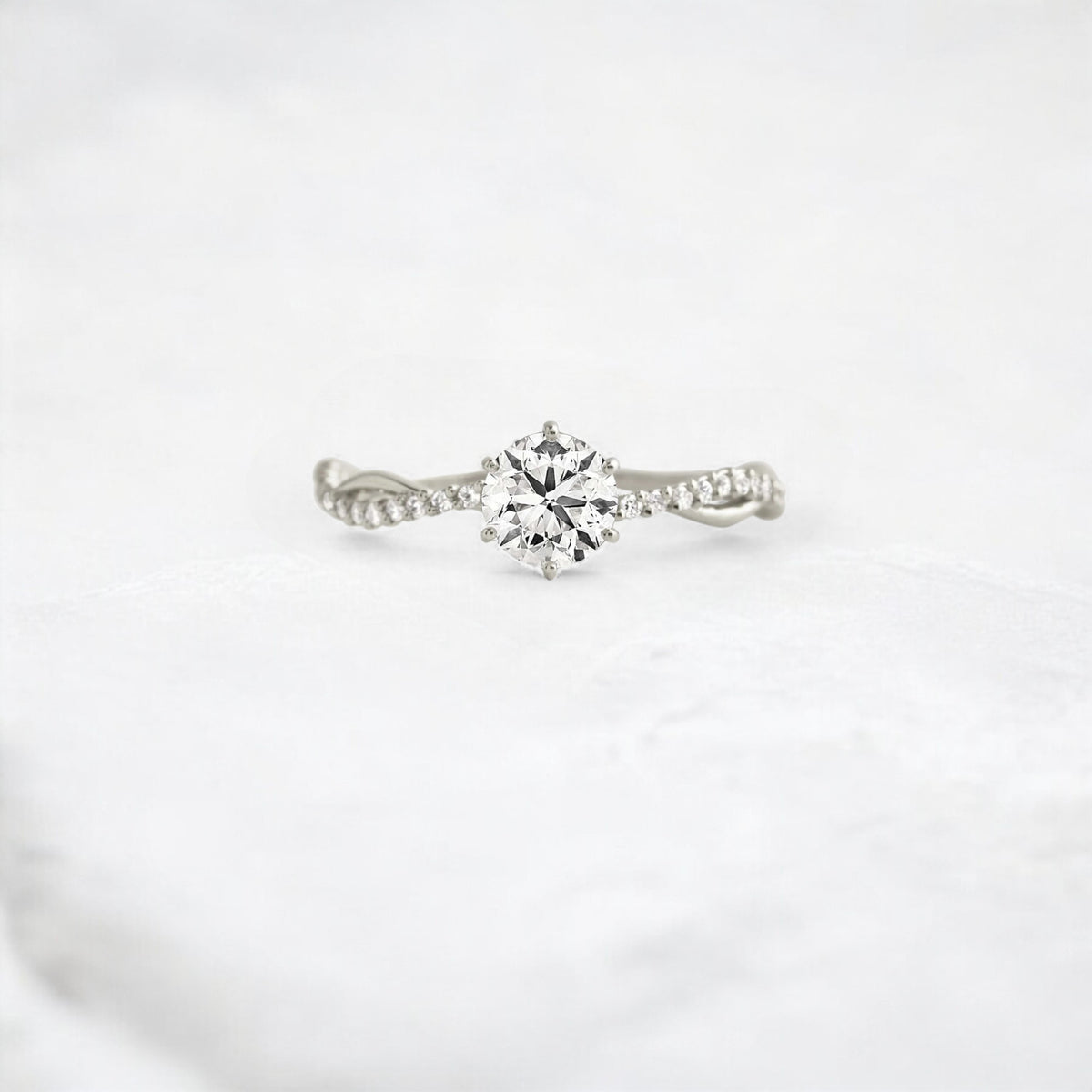twist-of-love-round-cut-moissanite-pave-engagement-ring-0-70-ct-platinum-gemfora-1