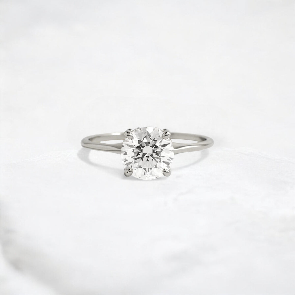 whispering-aurora-round-v-embrace-solitaire-engagement-ring-2-ct-platinum-gemfora-1