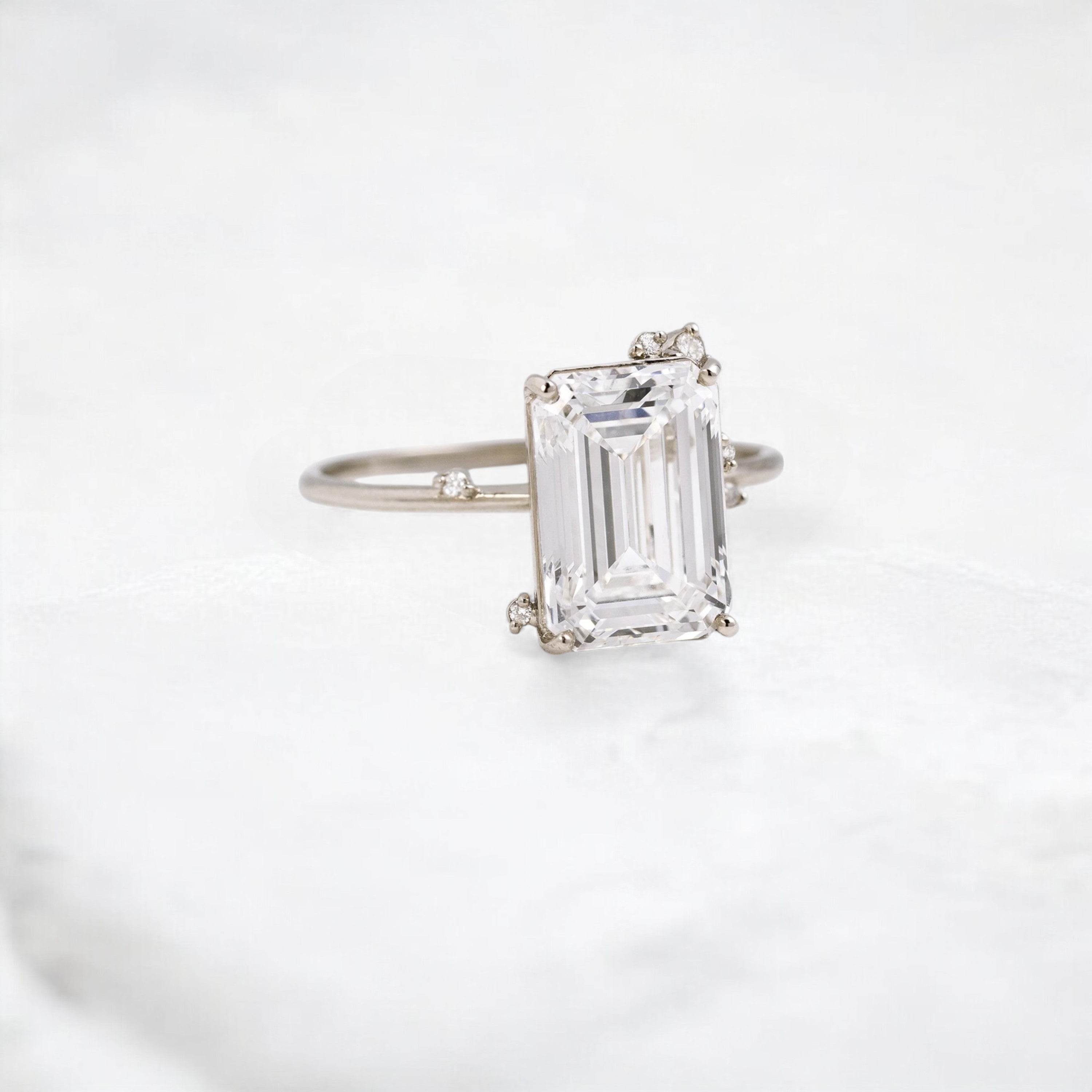 white-flameleaf-petals-emerald-moissanite-engagement-ring-4-25-ct-white-gold-gemfora-2